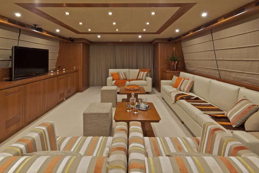 a room with a tv and couches