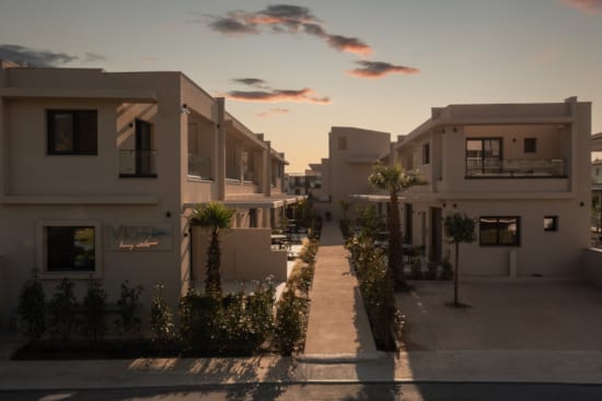 a street with palm trees and buildings