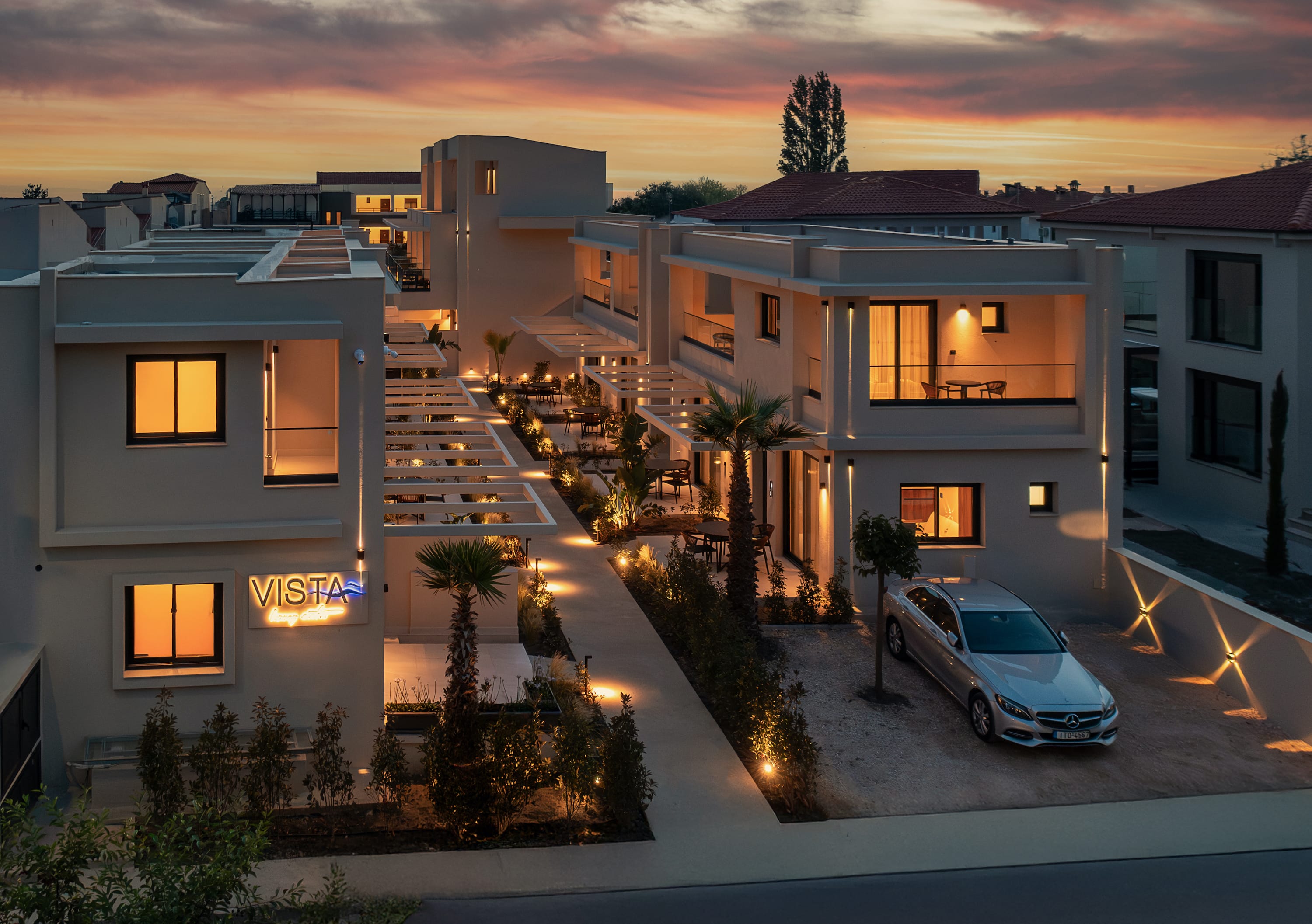 a house with a car parked in the driveway
