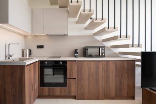 a kitchen with white cabinets