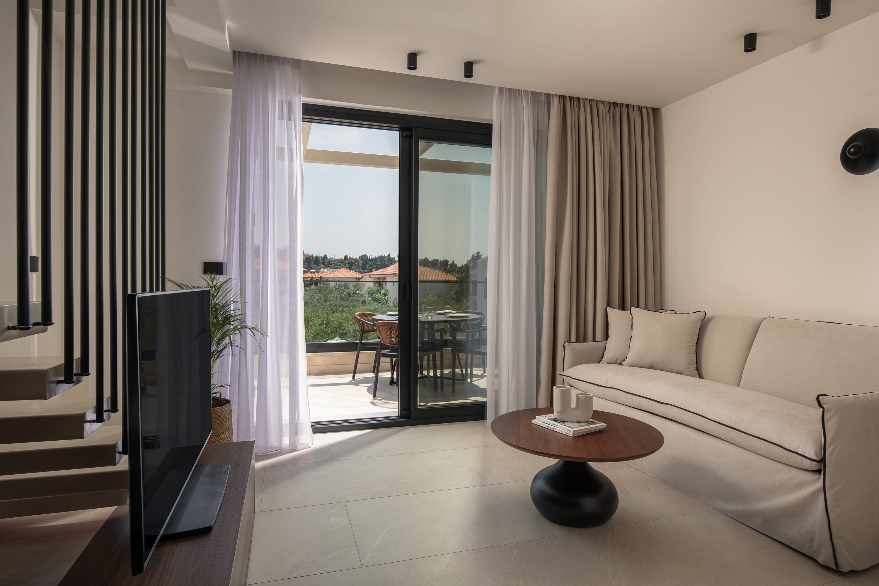 a living room with a large glass door