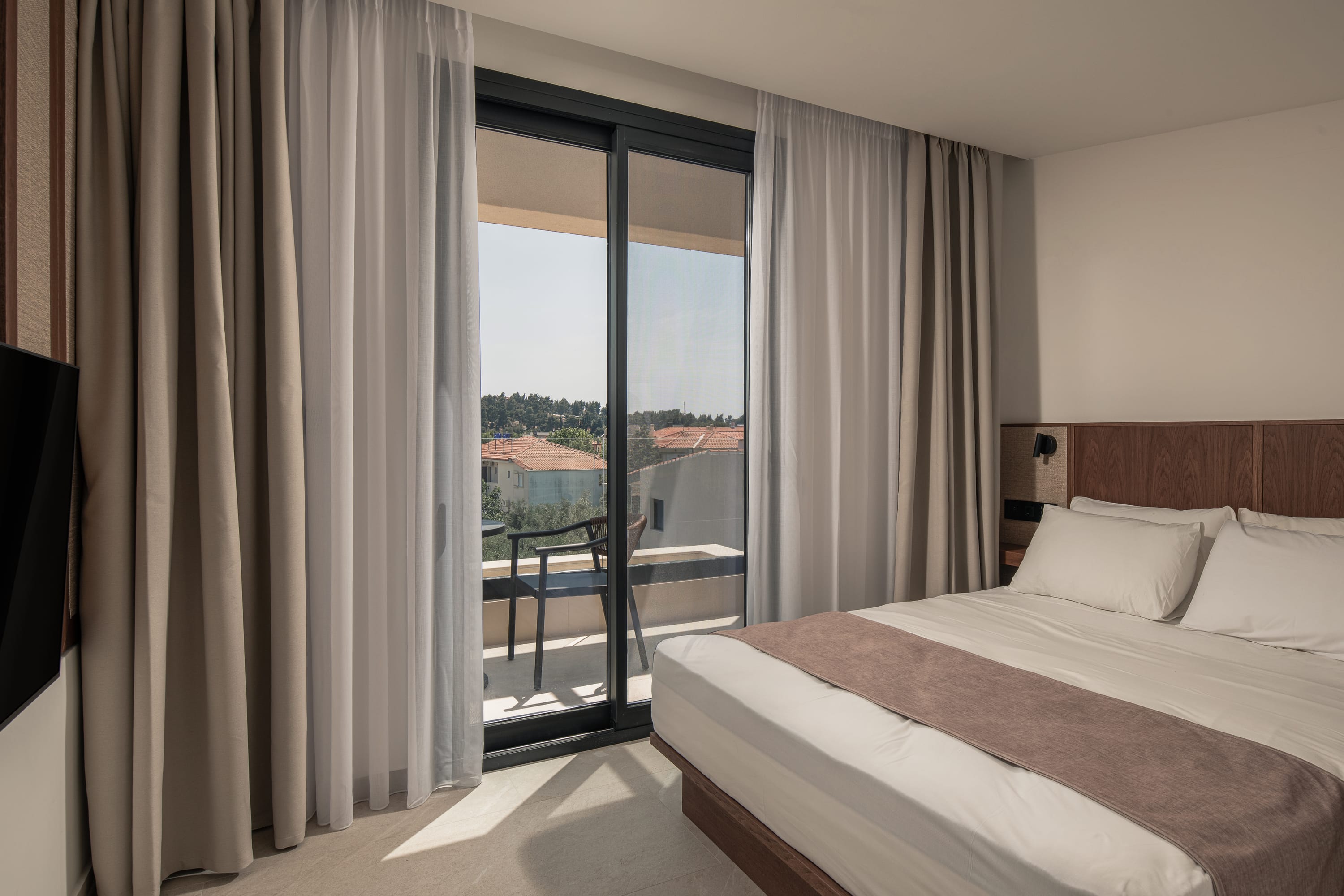 a bedroom with a large window