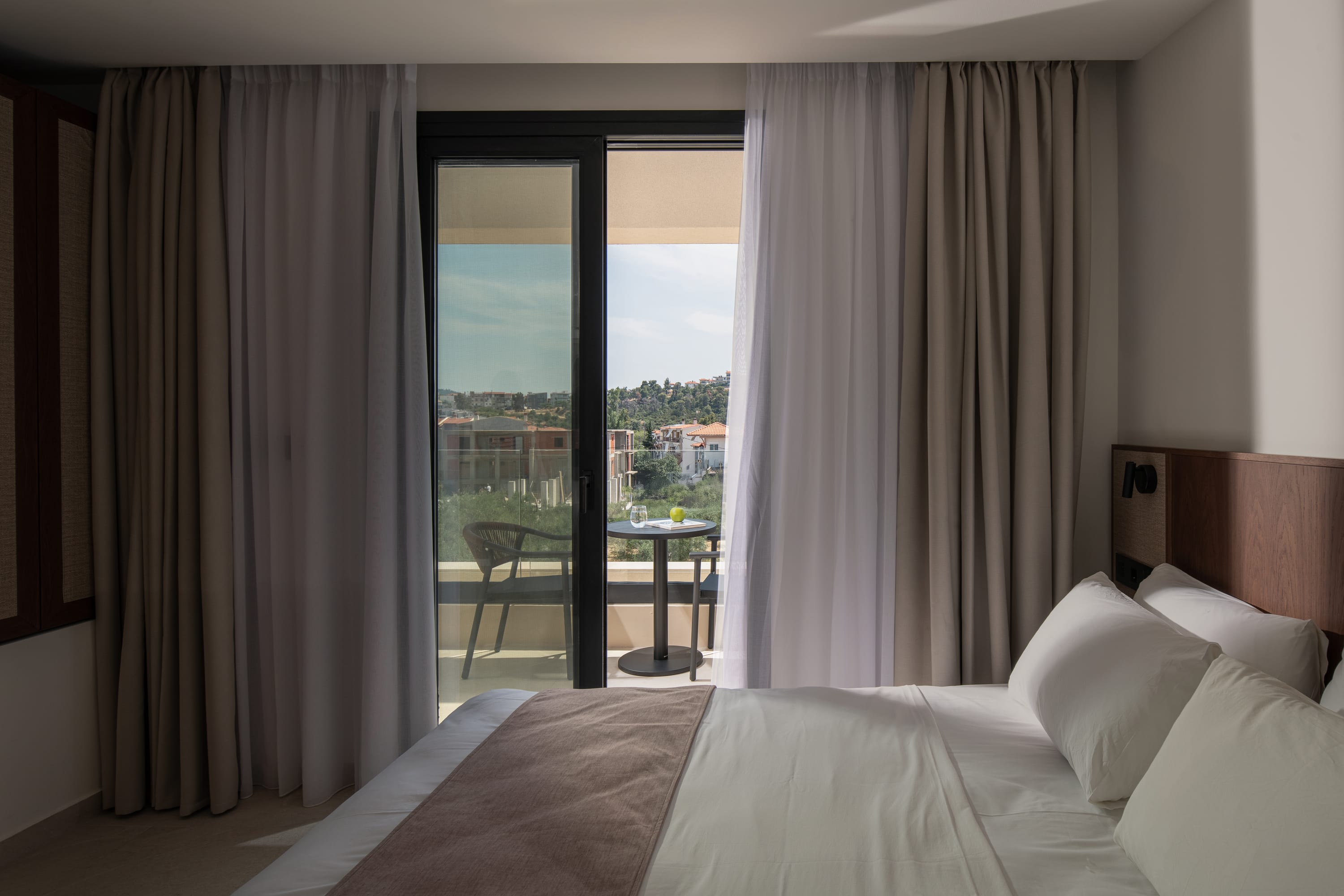 a bedroom with a large window