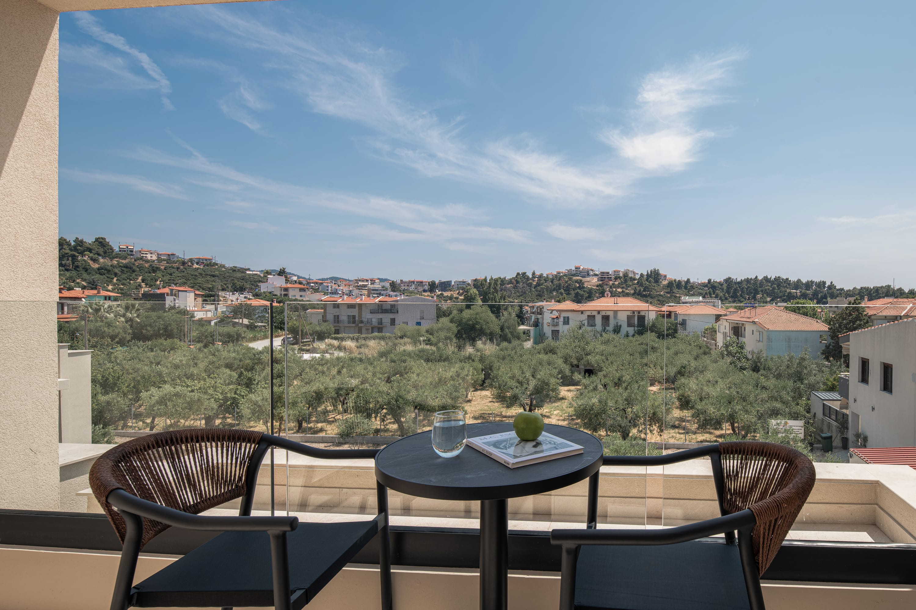 a table and chairs on a balcony