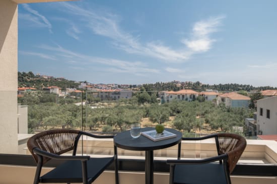 a table and chairs on a balcony