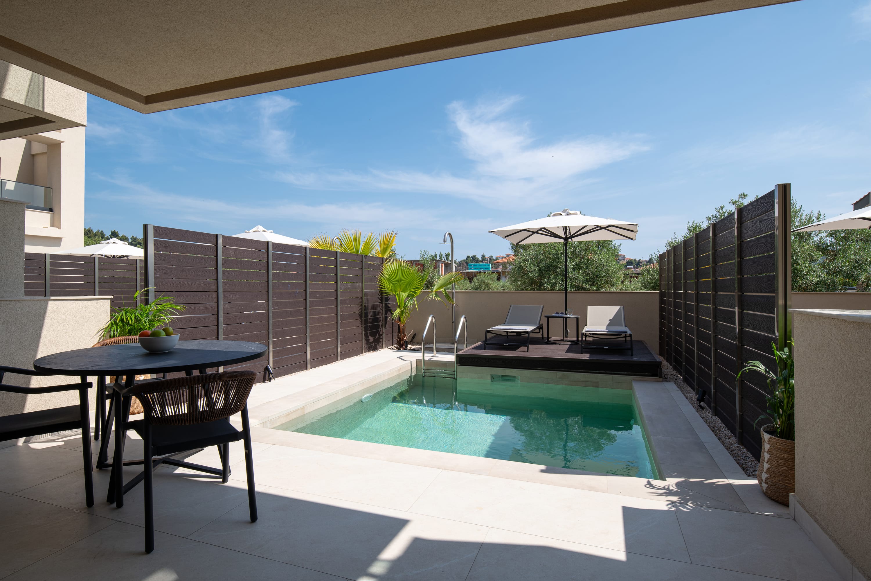 a pool with a table and chairs