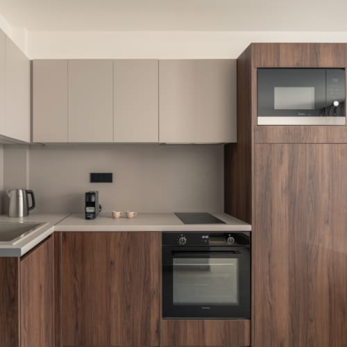 a kitchen with wooden cabinets