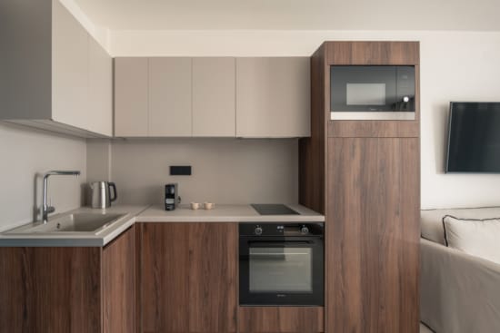 a kitchen with wooden cabinets