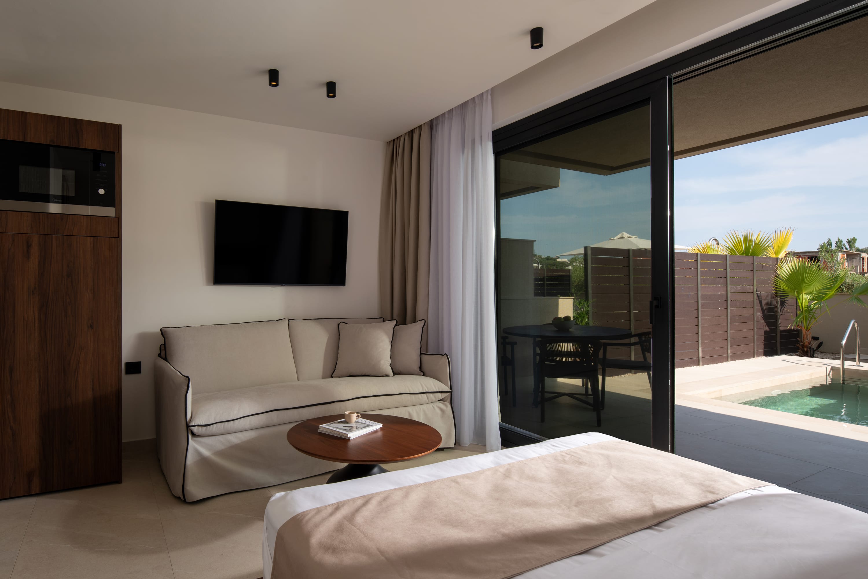 a living room with a large glass door