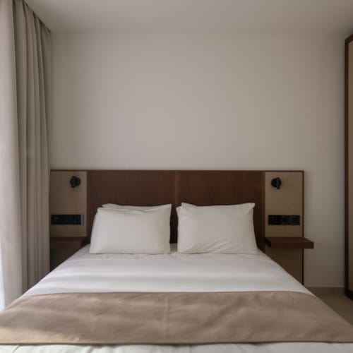 a bed with white sheets