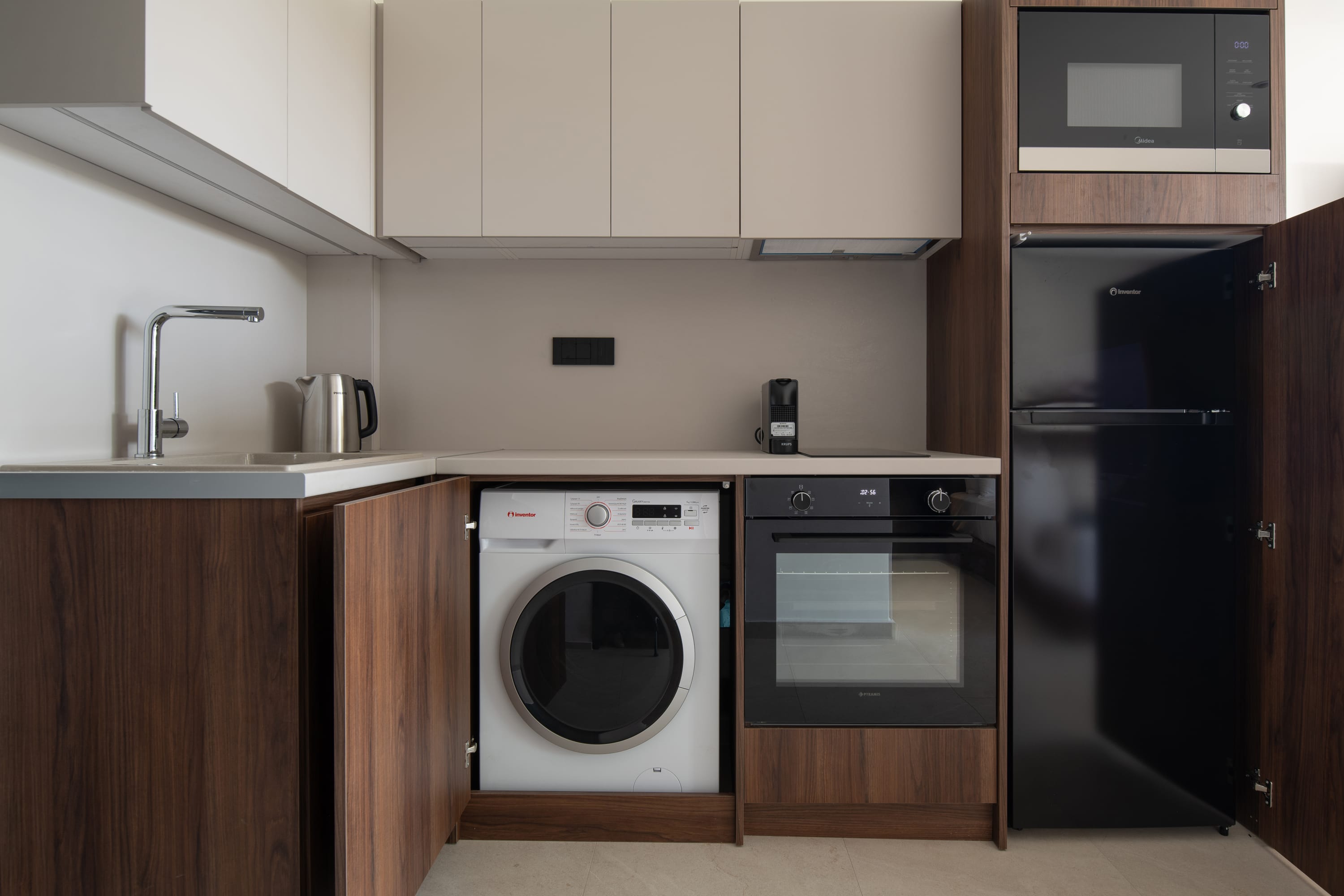 a kitchen with white cabinets