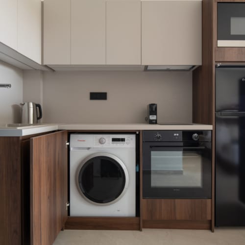 a kitchen with white cabinets