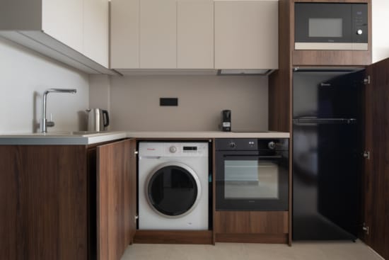 a kitchen with white cabinets