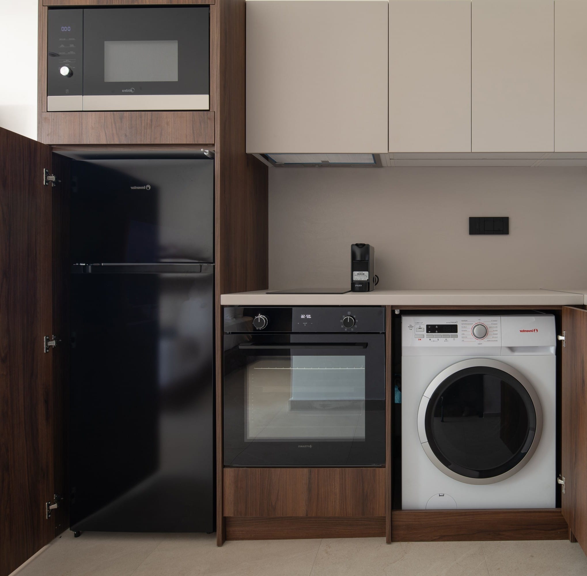 a kitchen with a refrigerator and microwave