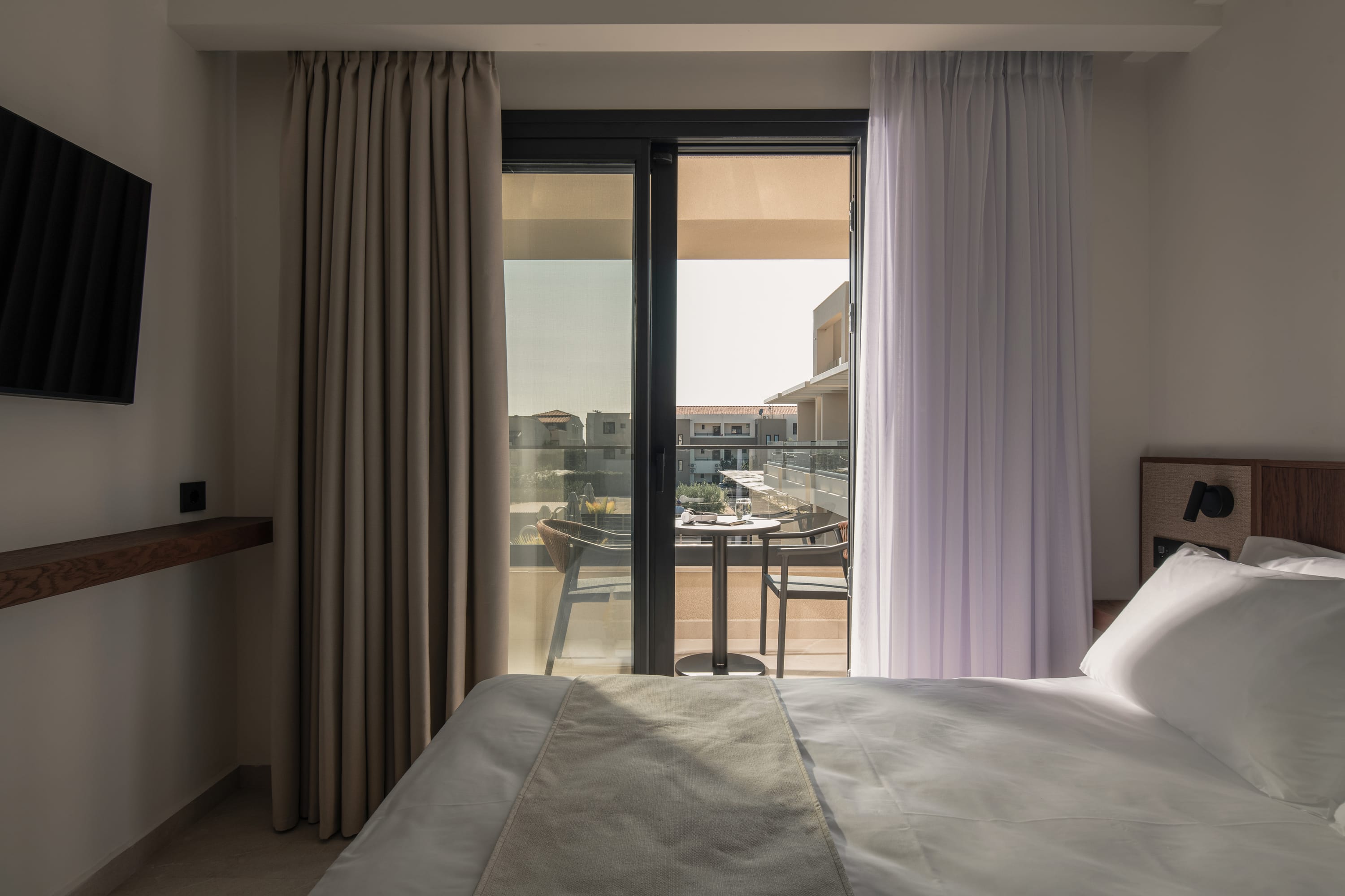 a bedroom with a large window