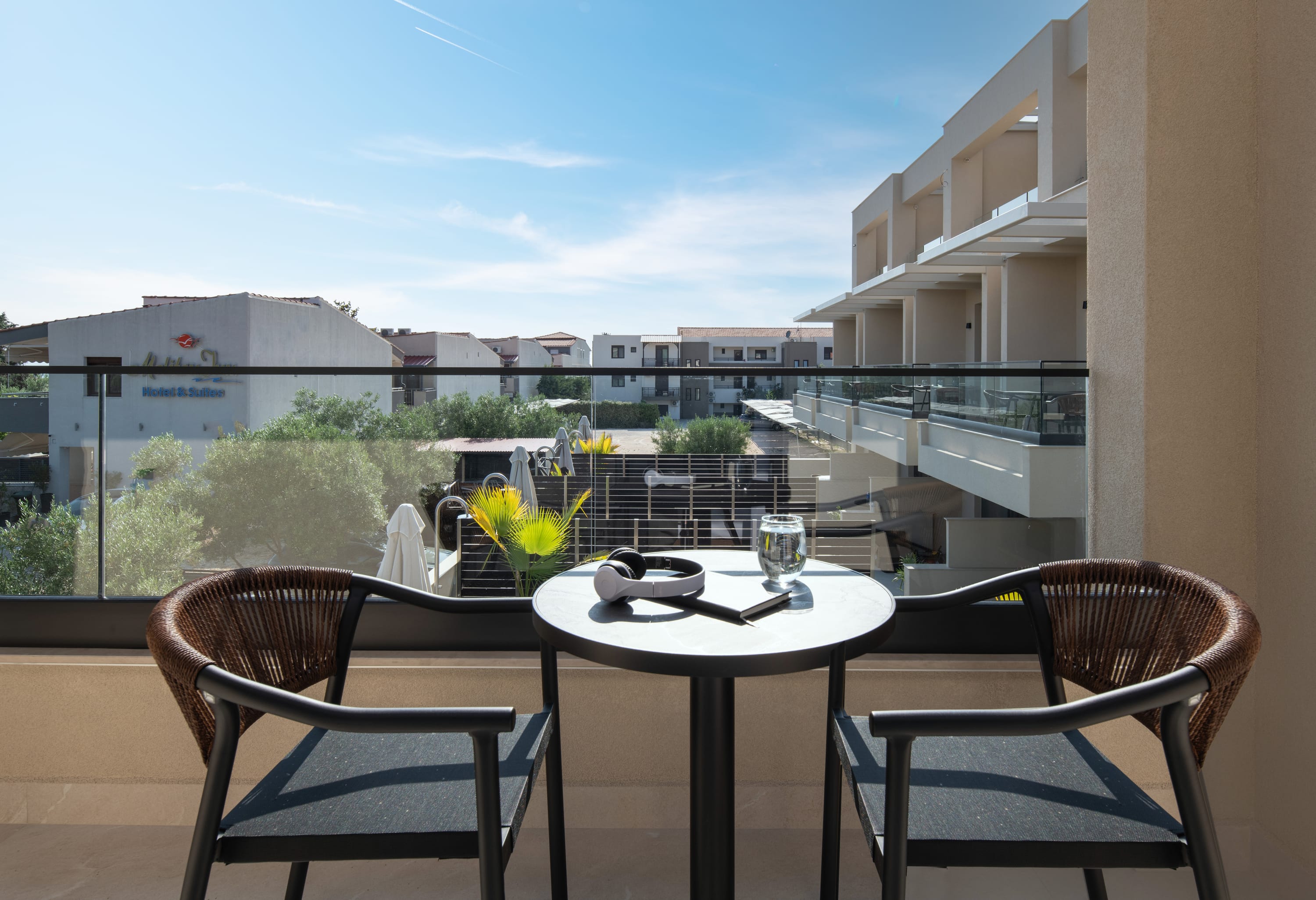 a table and chairs on a balcony