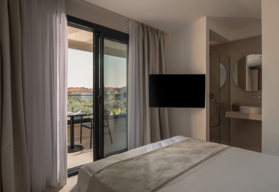 a bedroom with a large glass door