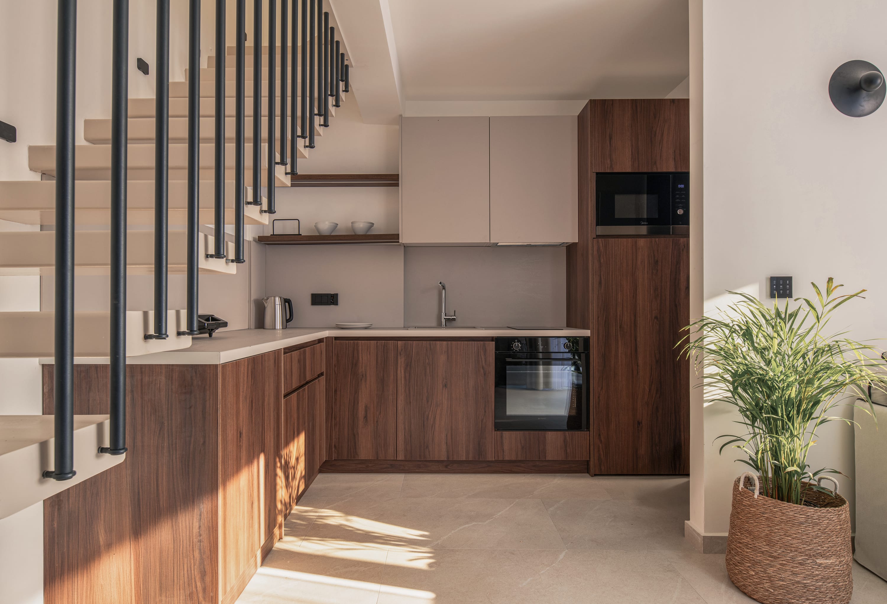 a kitchen with a black microwave oven