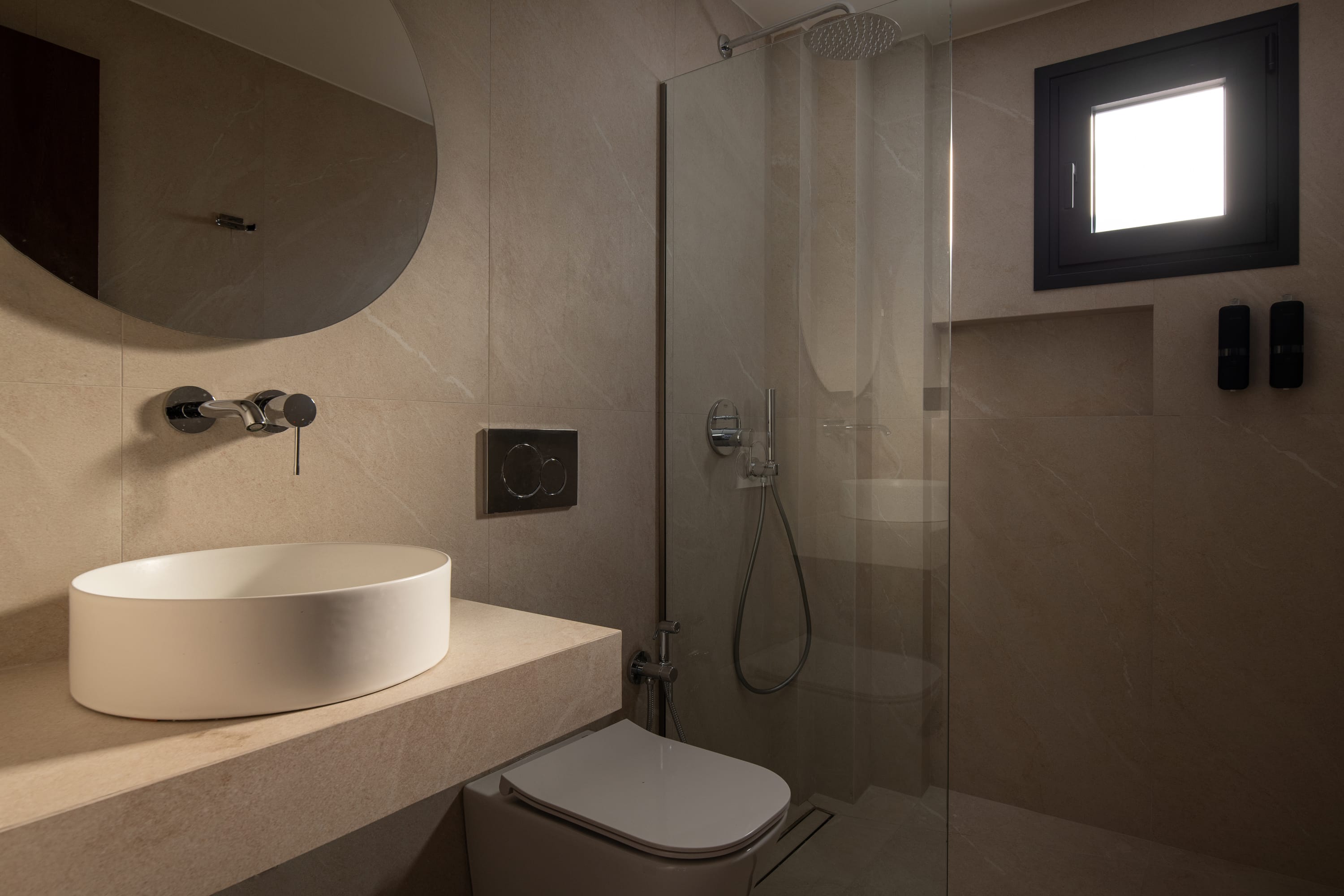 a bathroom with a sink and a shower unit