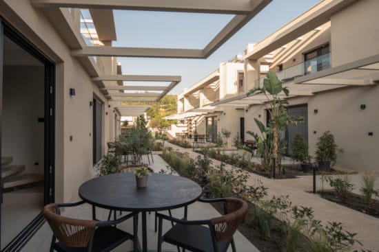 a table and chairs outside a building