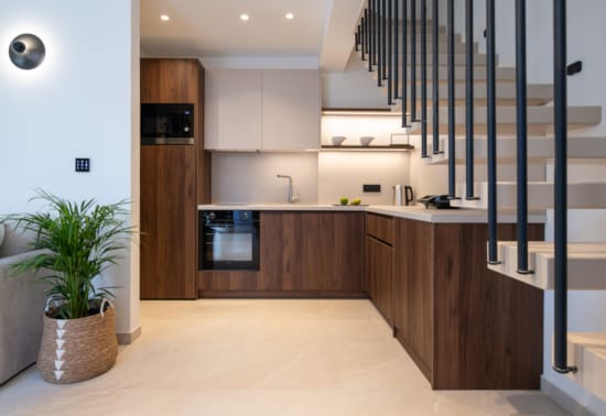 a kitchen with wooden cabinets
