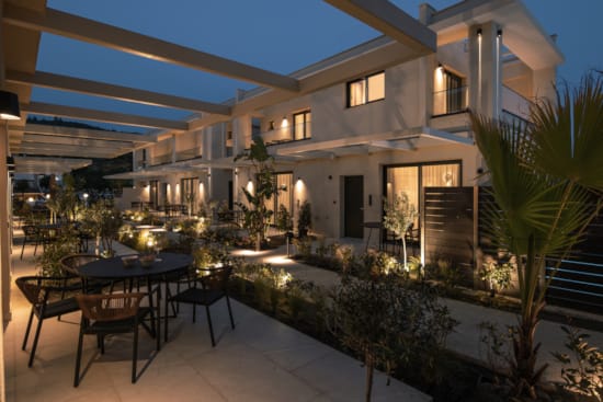 a house with a patio and tables