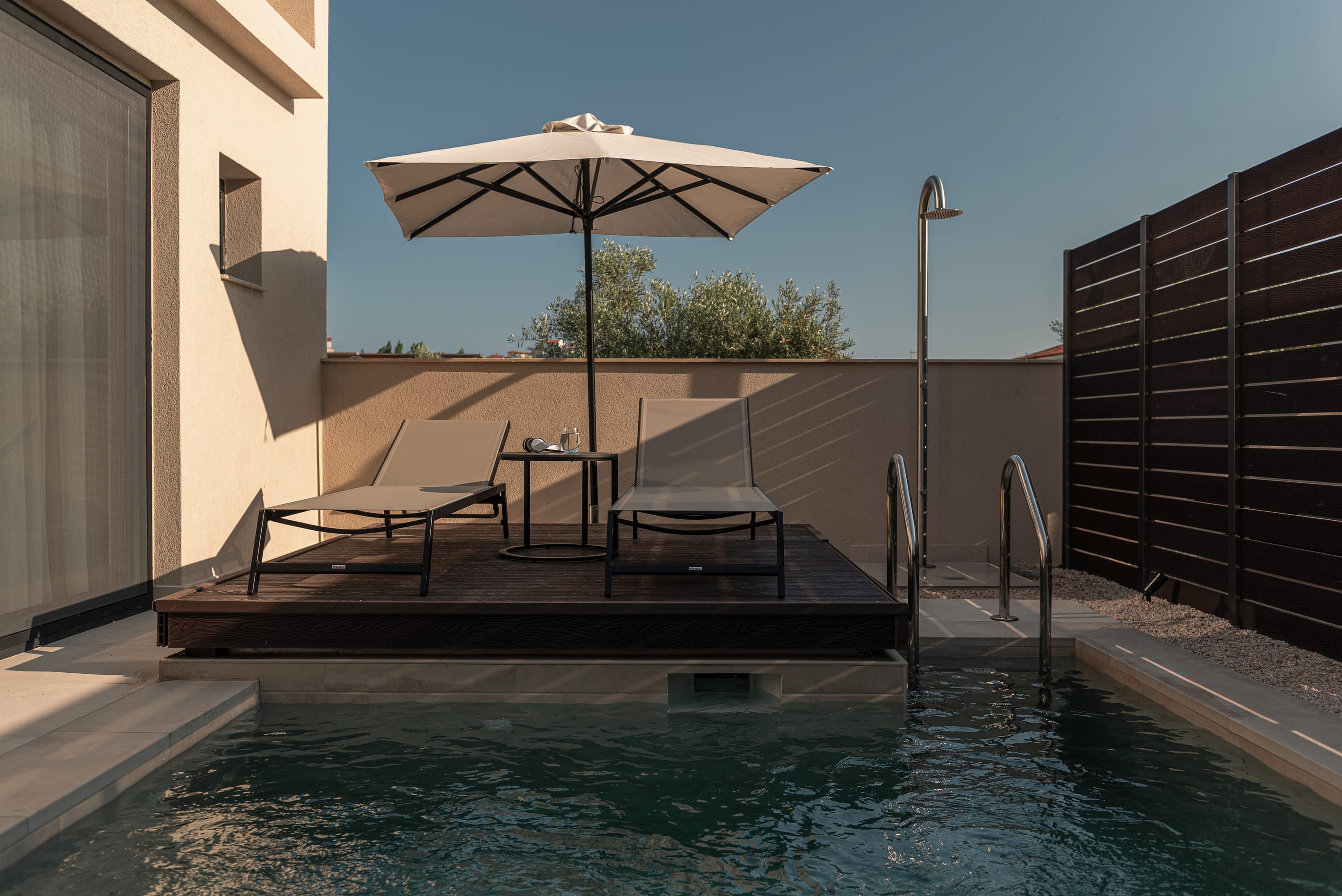 a pool with a table and chairs next to it