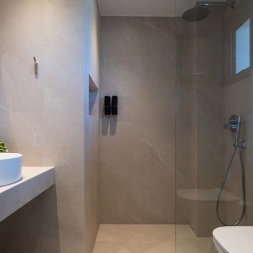 a bathroom with a shower unit