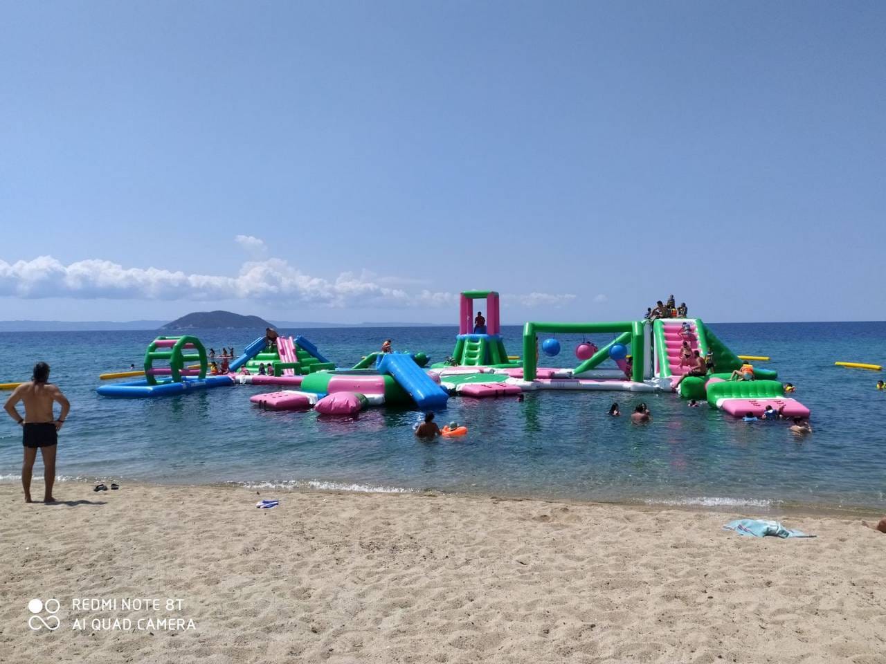 a beach with many boats