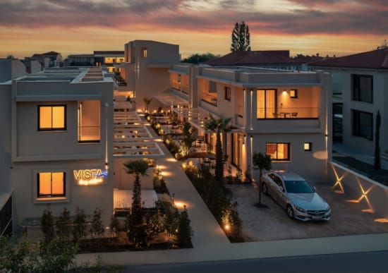 a house with a car parked in the driveway