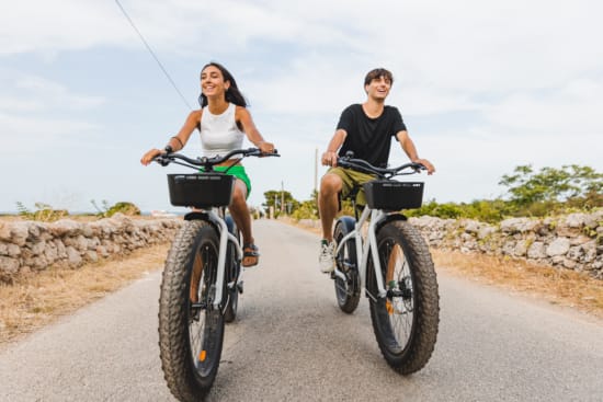 a man and a woman riding bikes