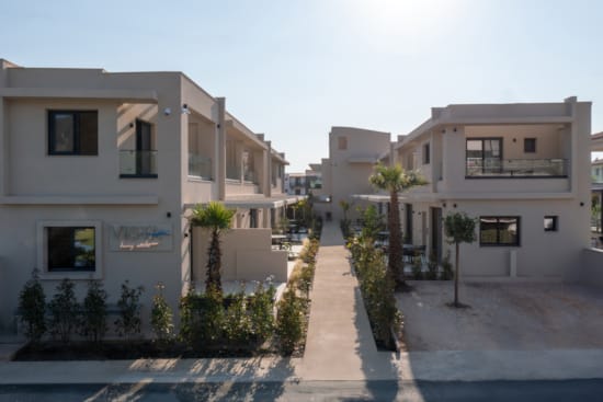a street with palm trees and buildings