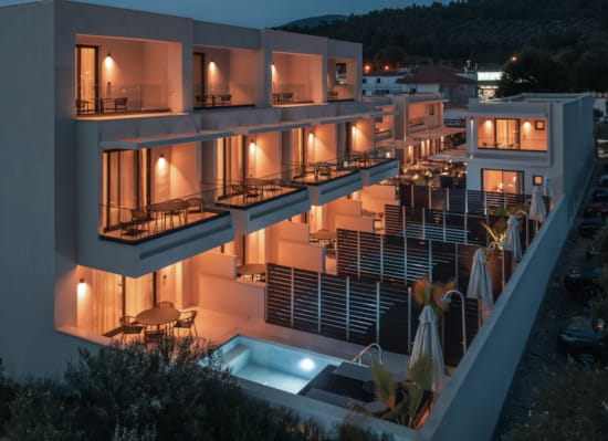 a house with a pool and a deck with a pool and a deck