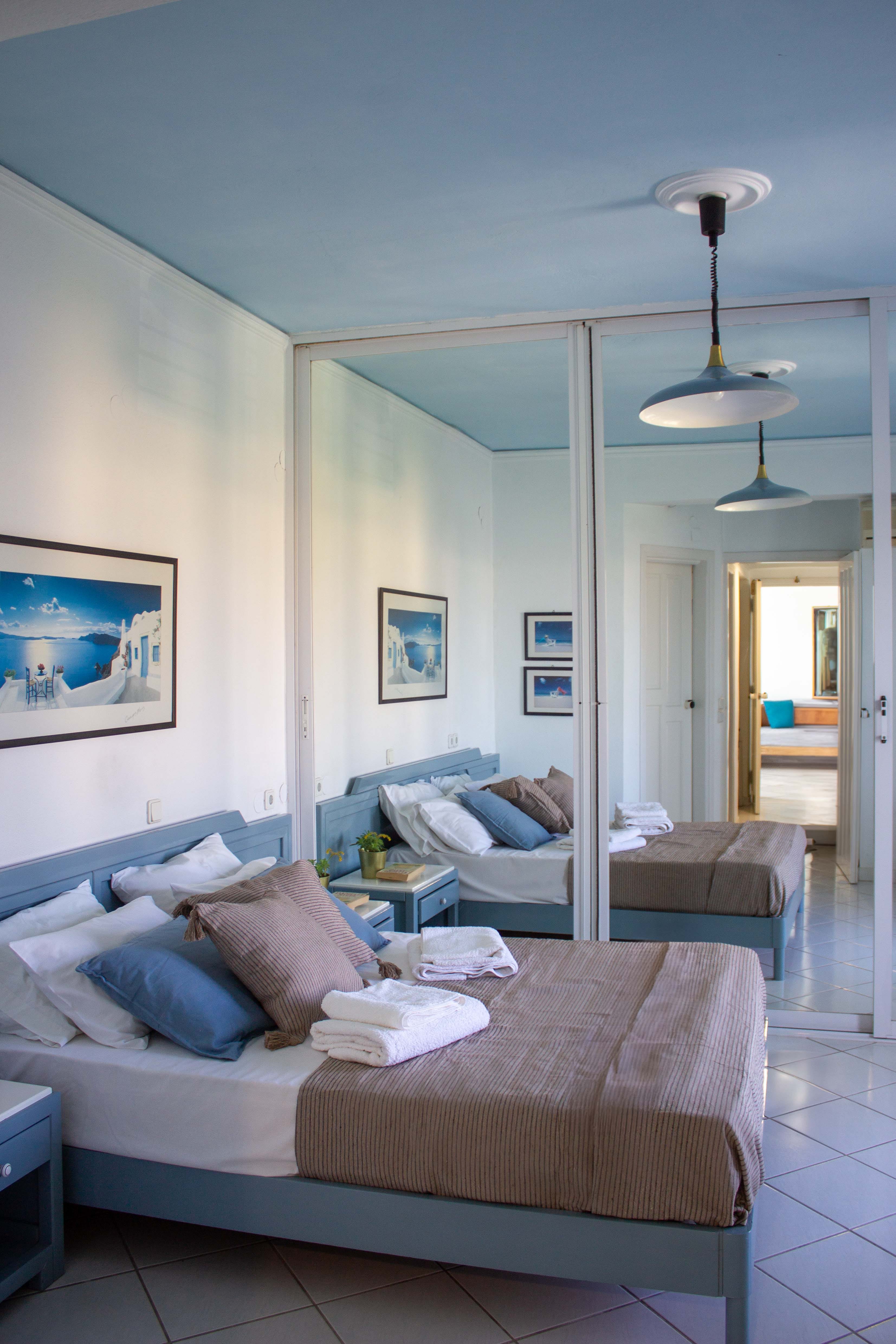 a bedroom with a bed and a couch