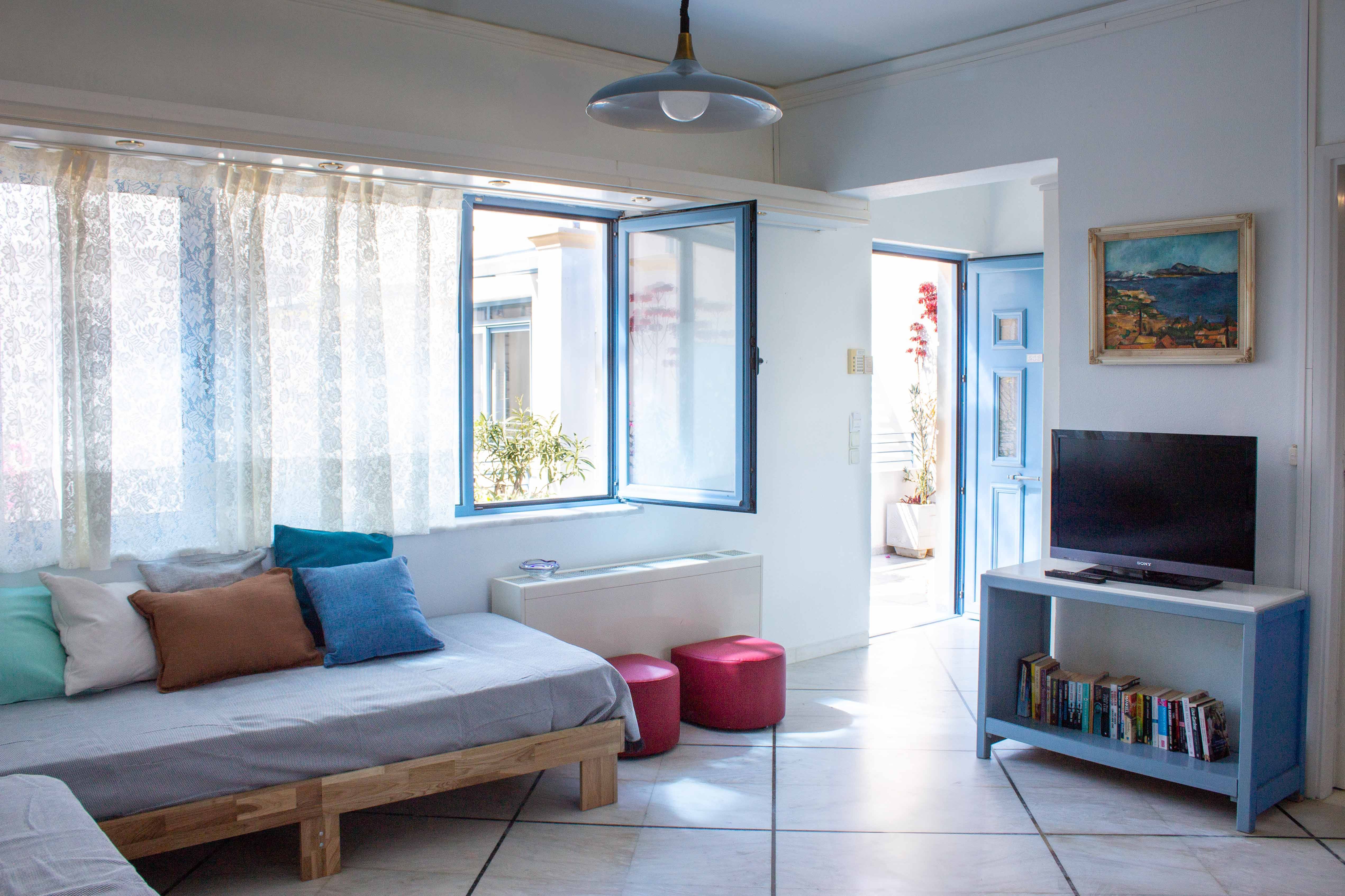 a living room with a tv and couches