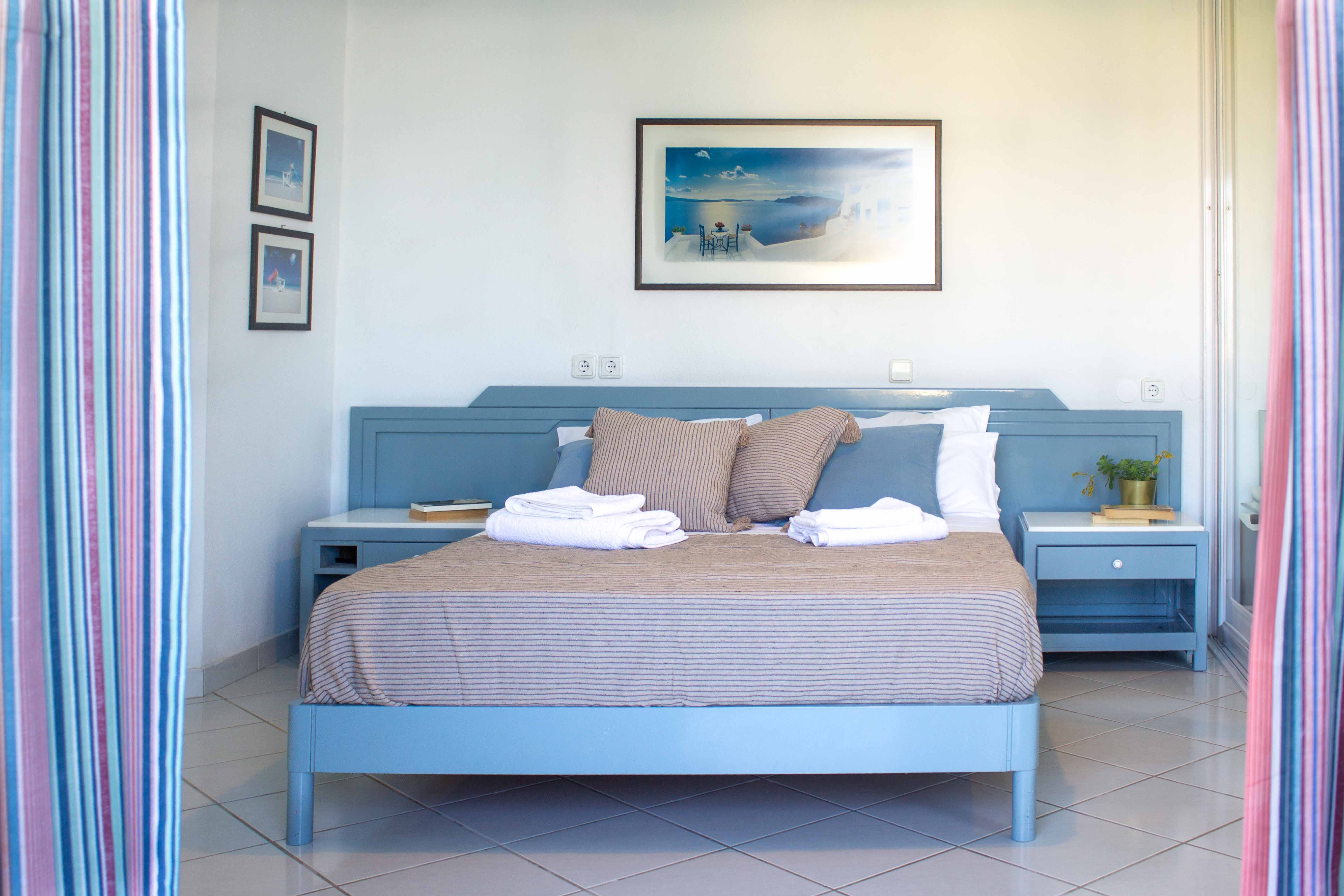 a bed with a blue cover