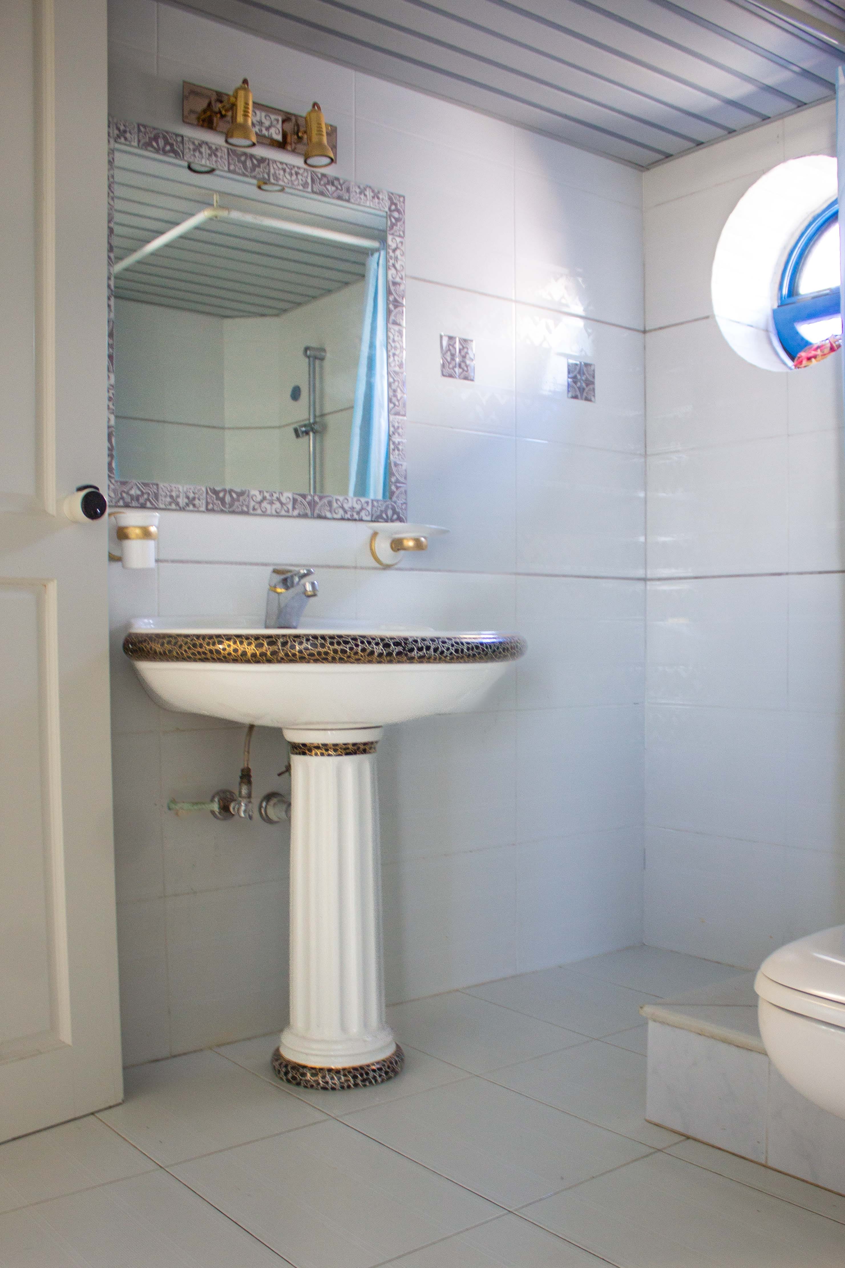 a bathroom with a sink and mirror
