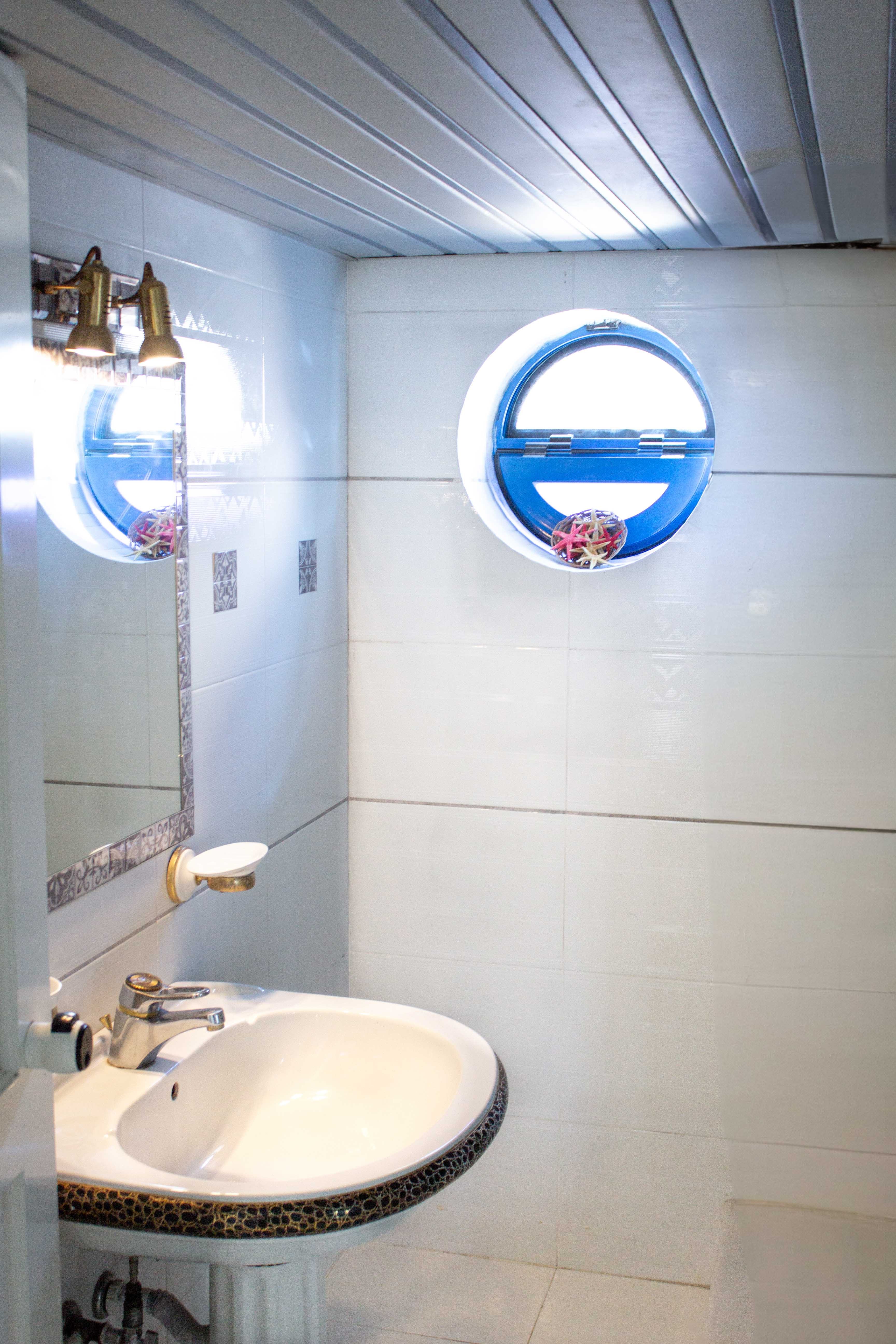 a bathroom with a mirror and sink