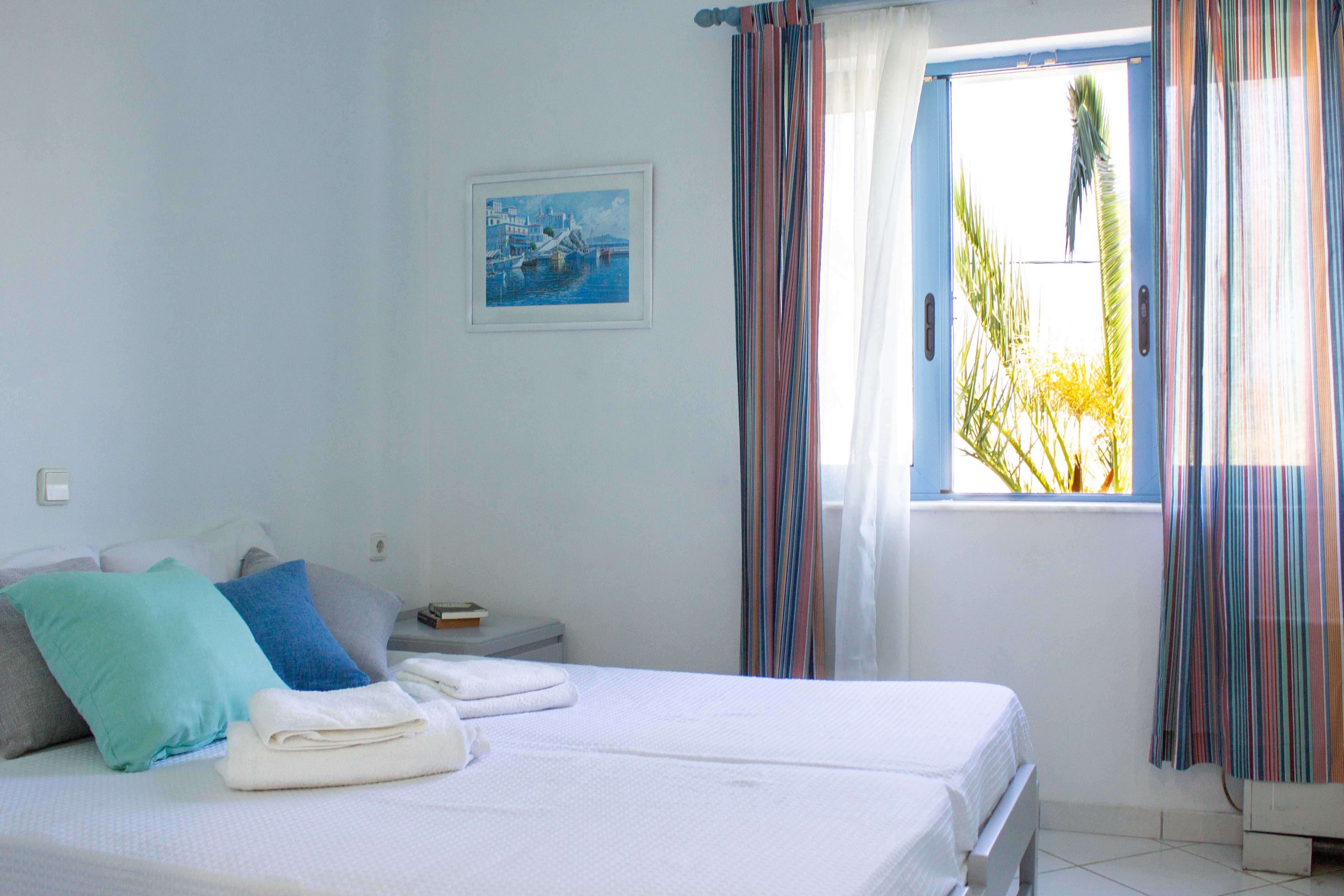 a bed with a white bed spread