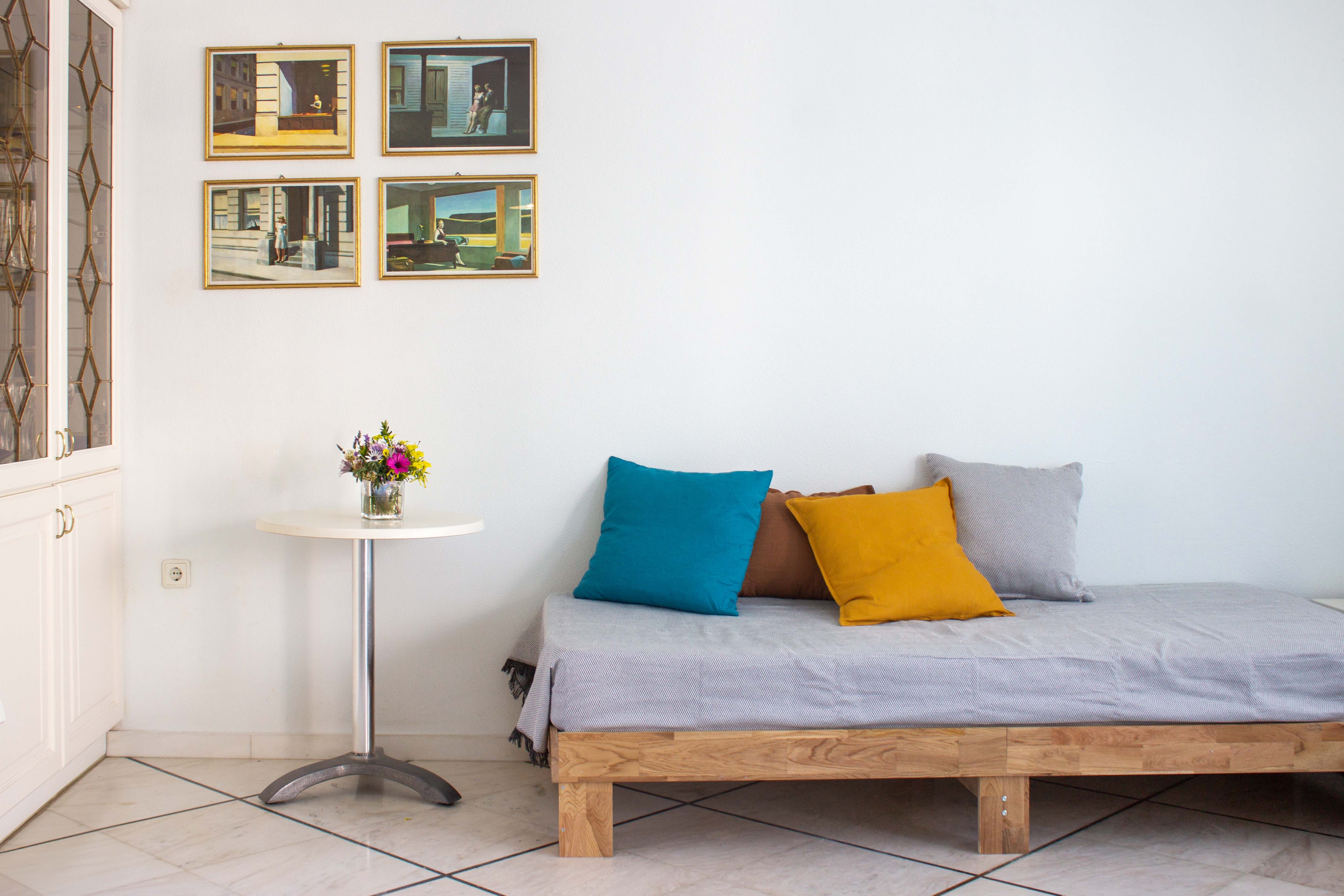 a bed with pillows and a table