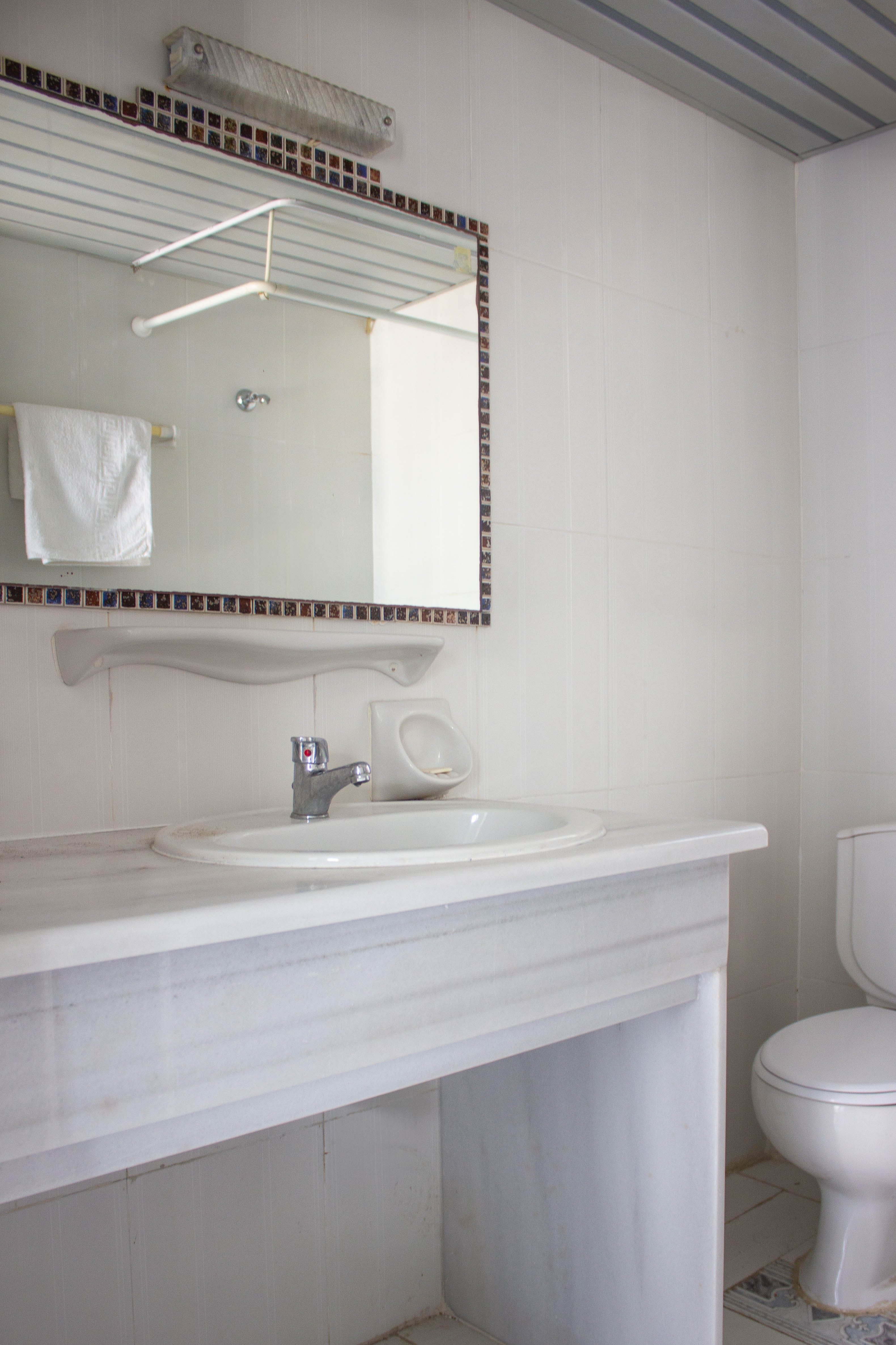 a bathroom with a sink and mirror
