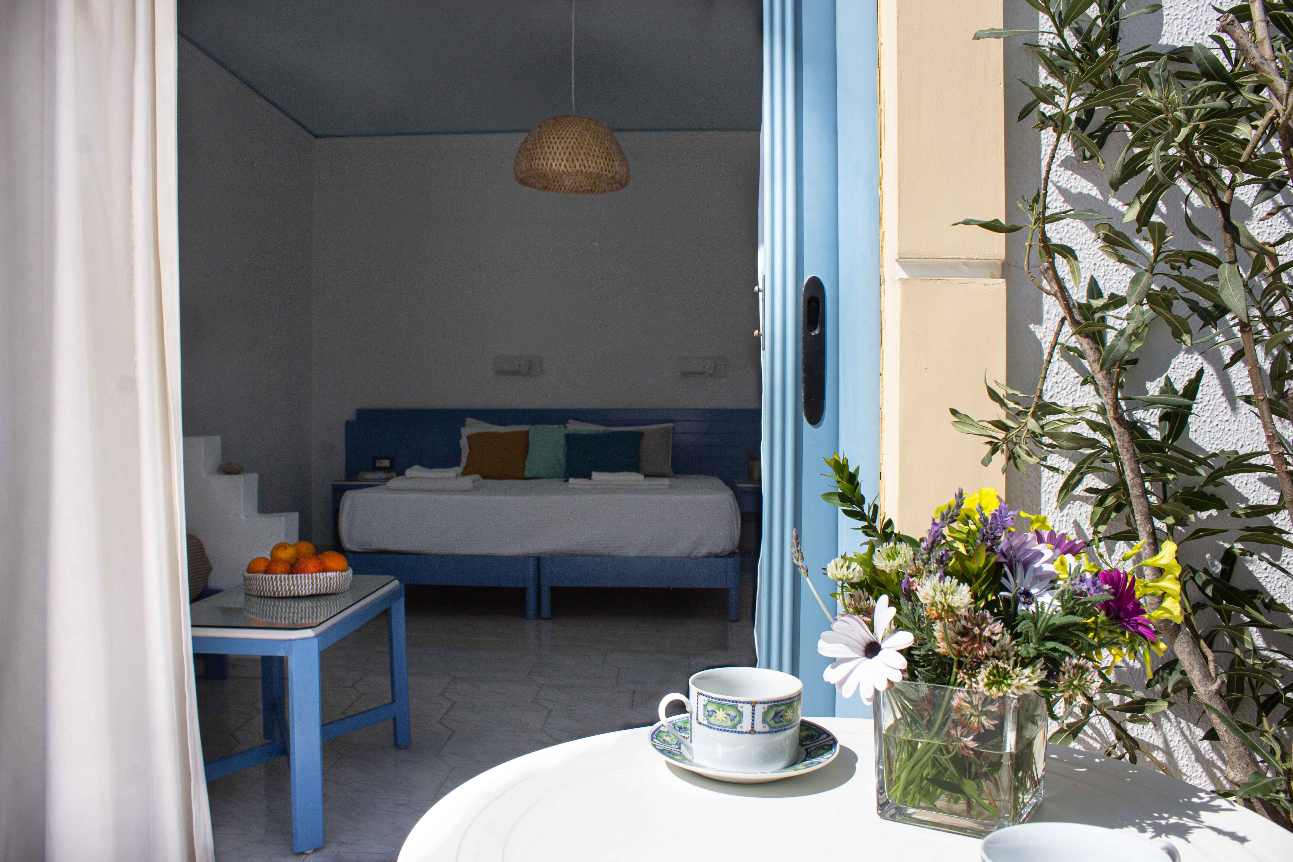 a room with a couch and flowers