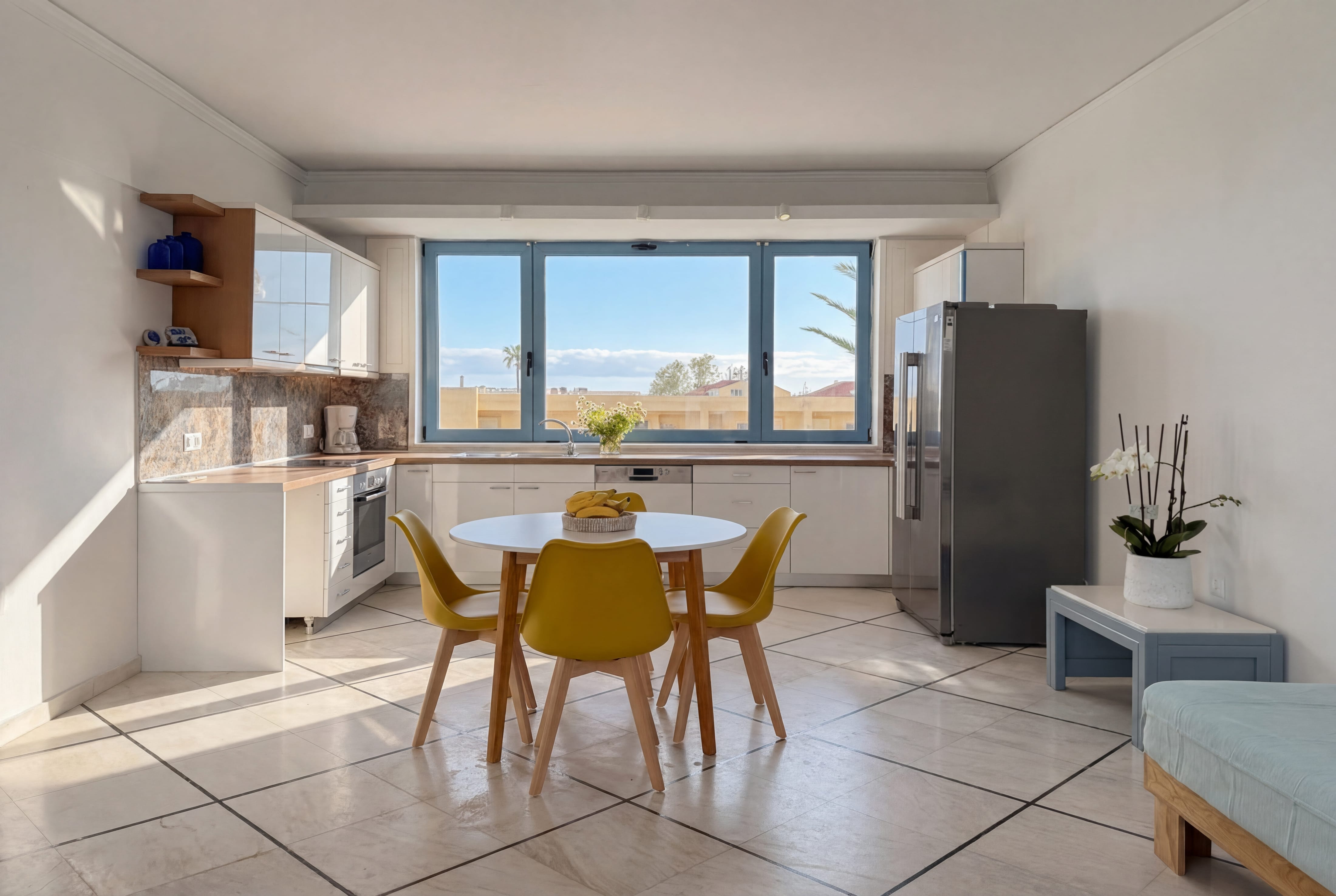 a kitchen with a table and chairs