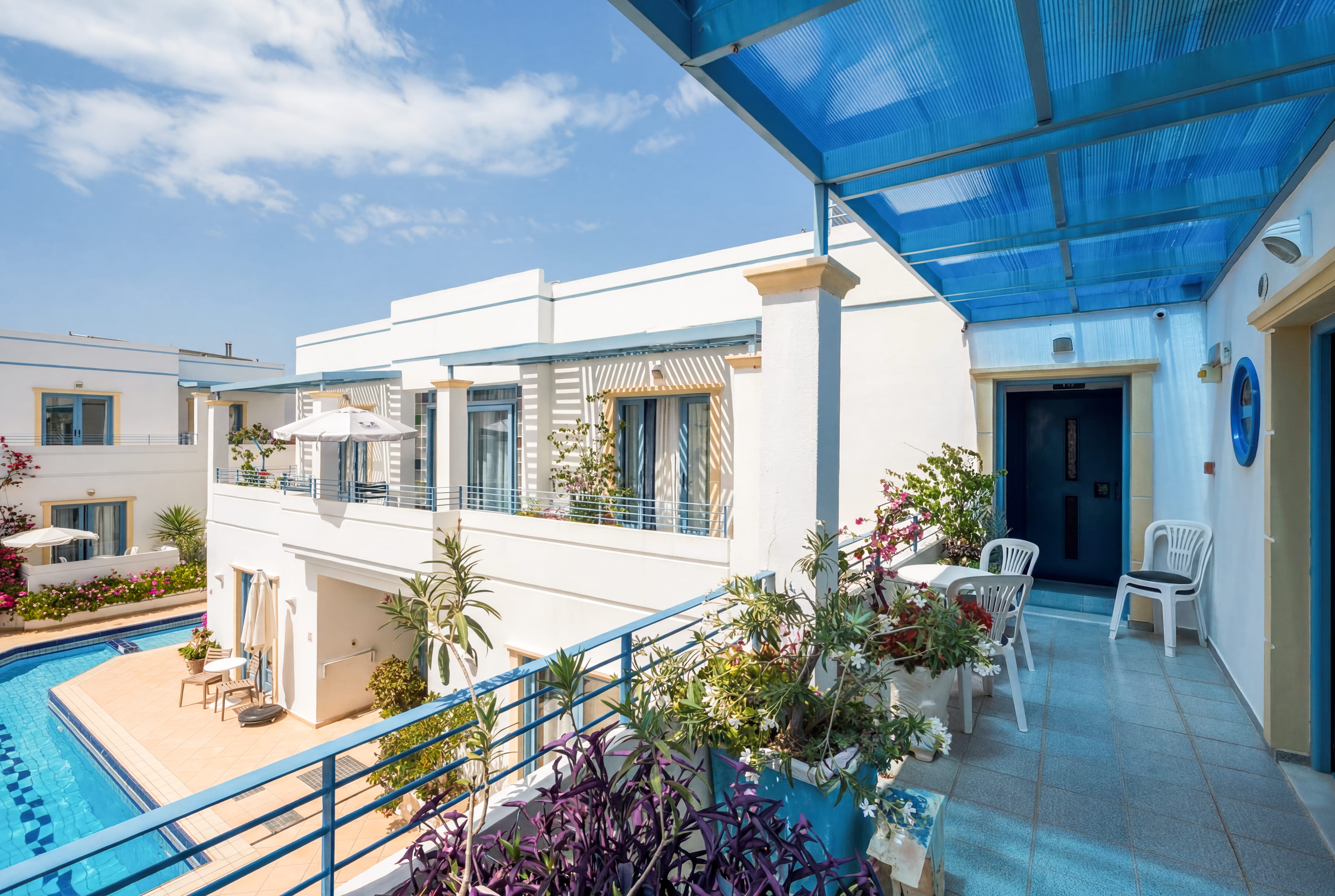 a patio with a blue roof