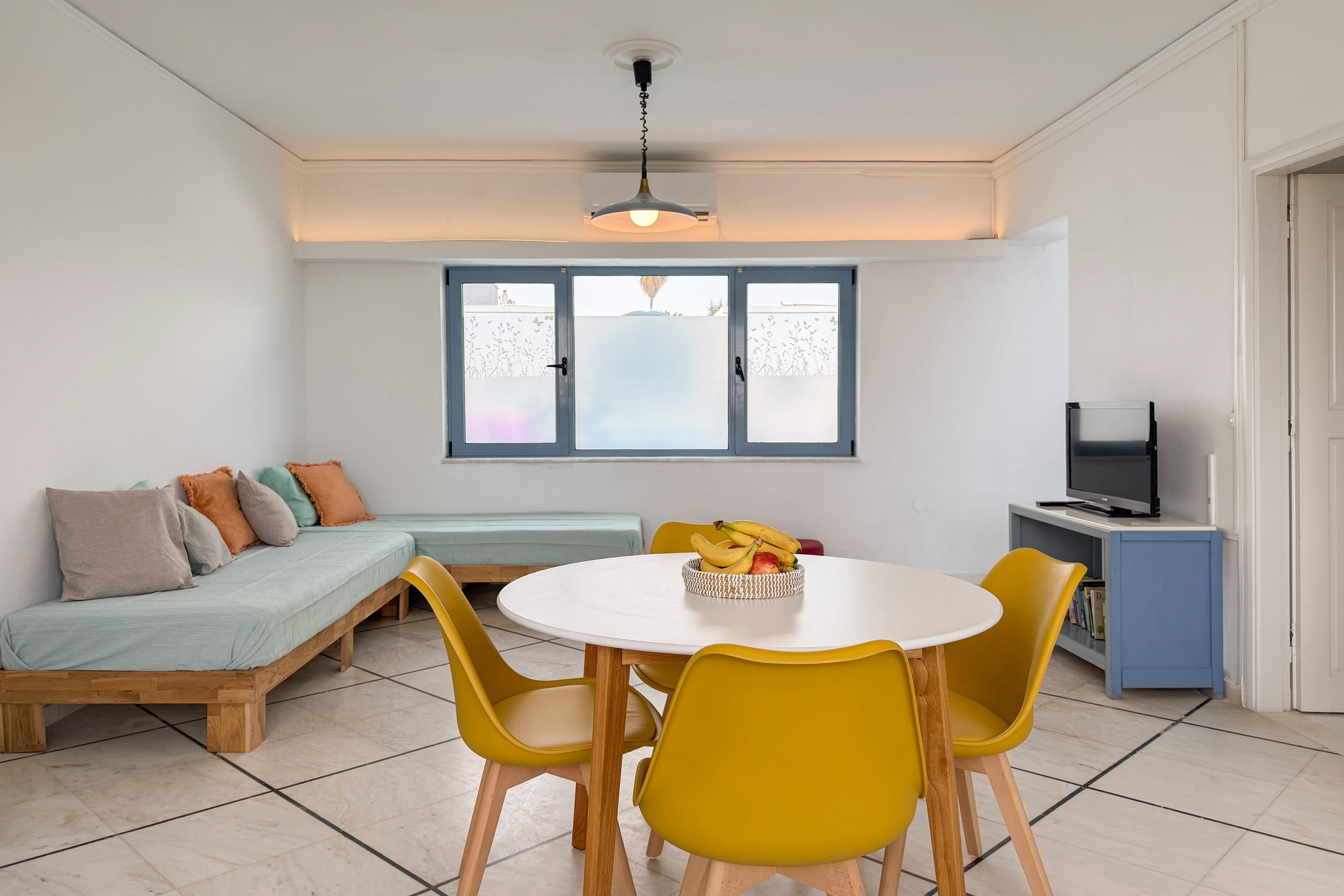 a room with a table and chairs