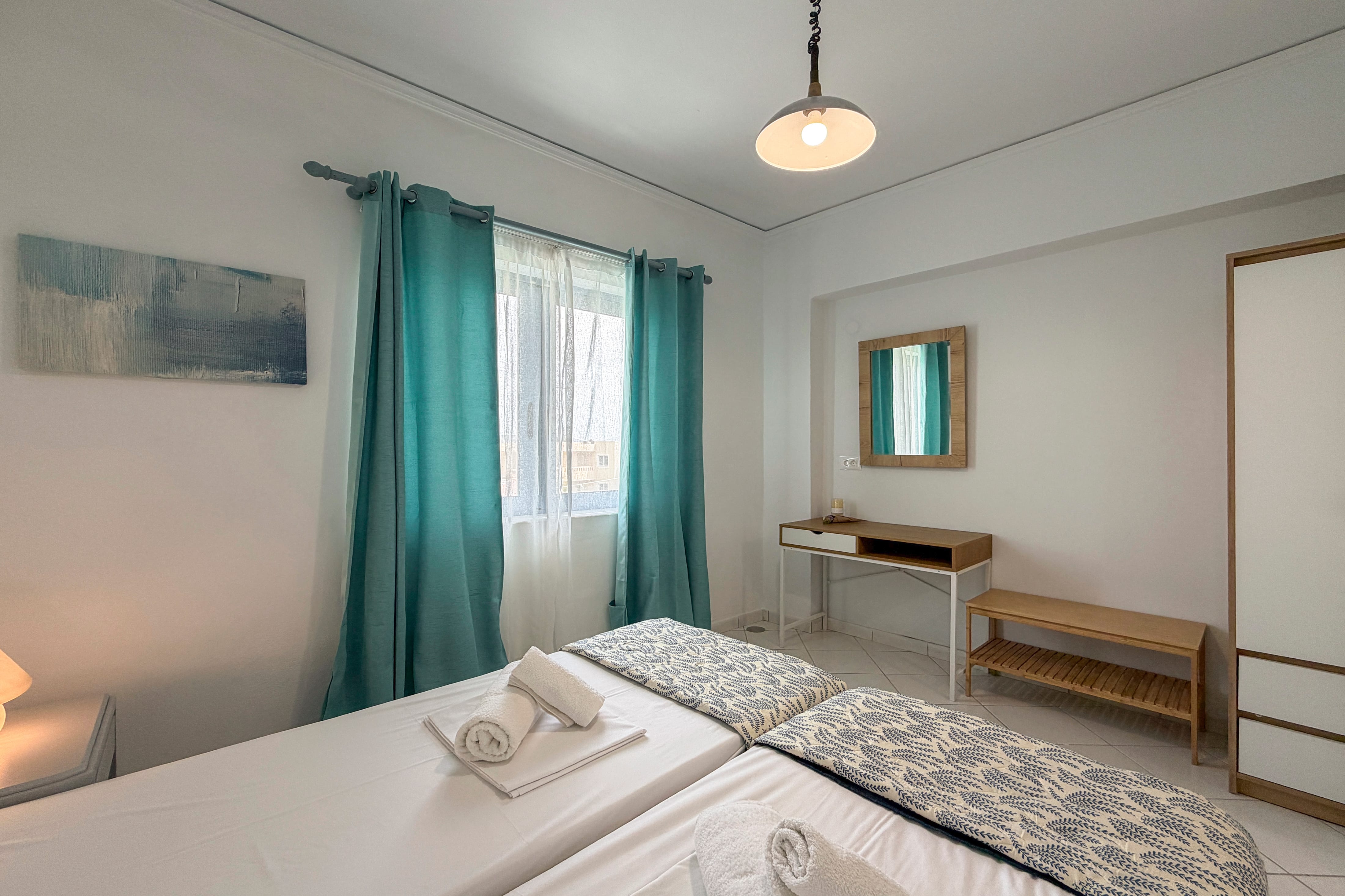 a room with a bed and a mirror