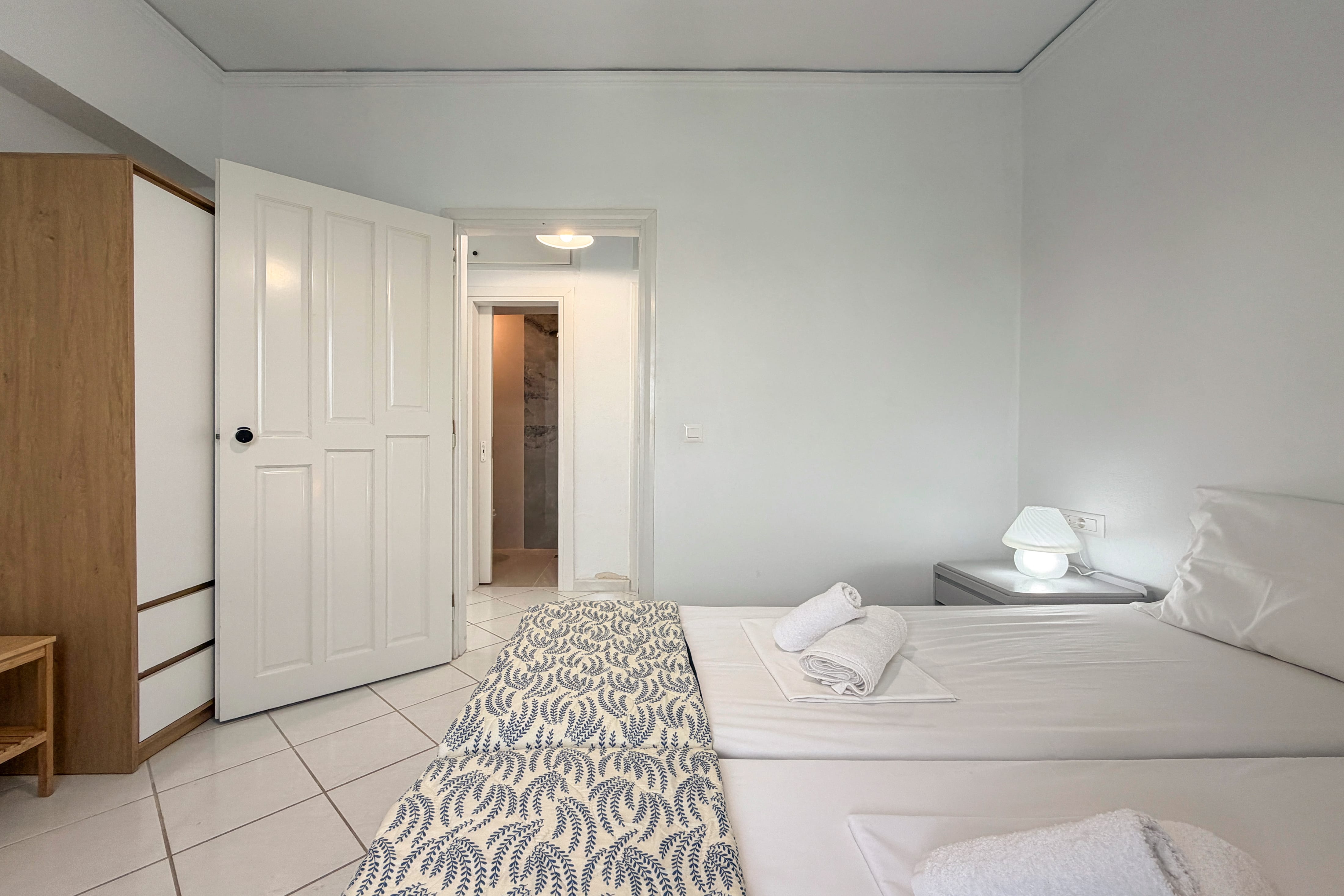 a bedroom with a bed and a door