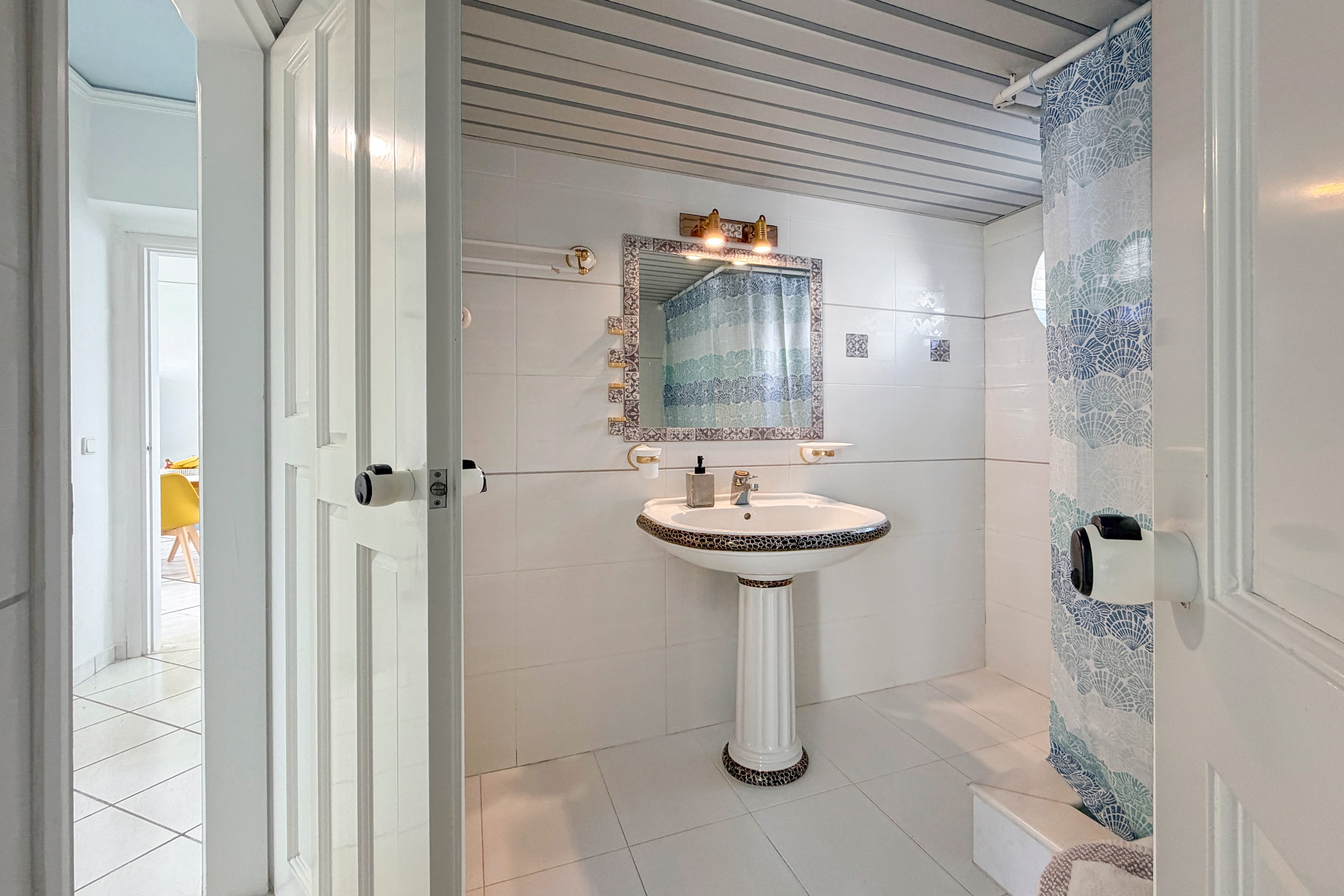 a bathroom with a sink and mirror