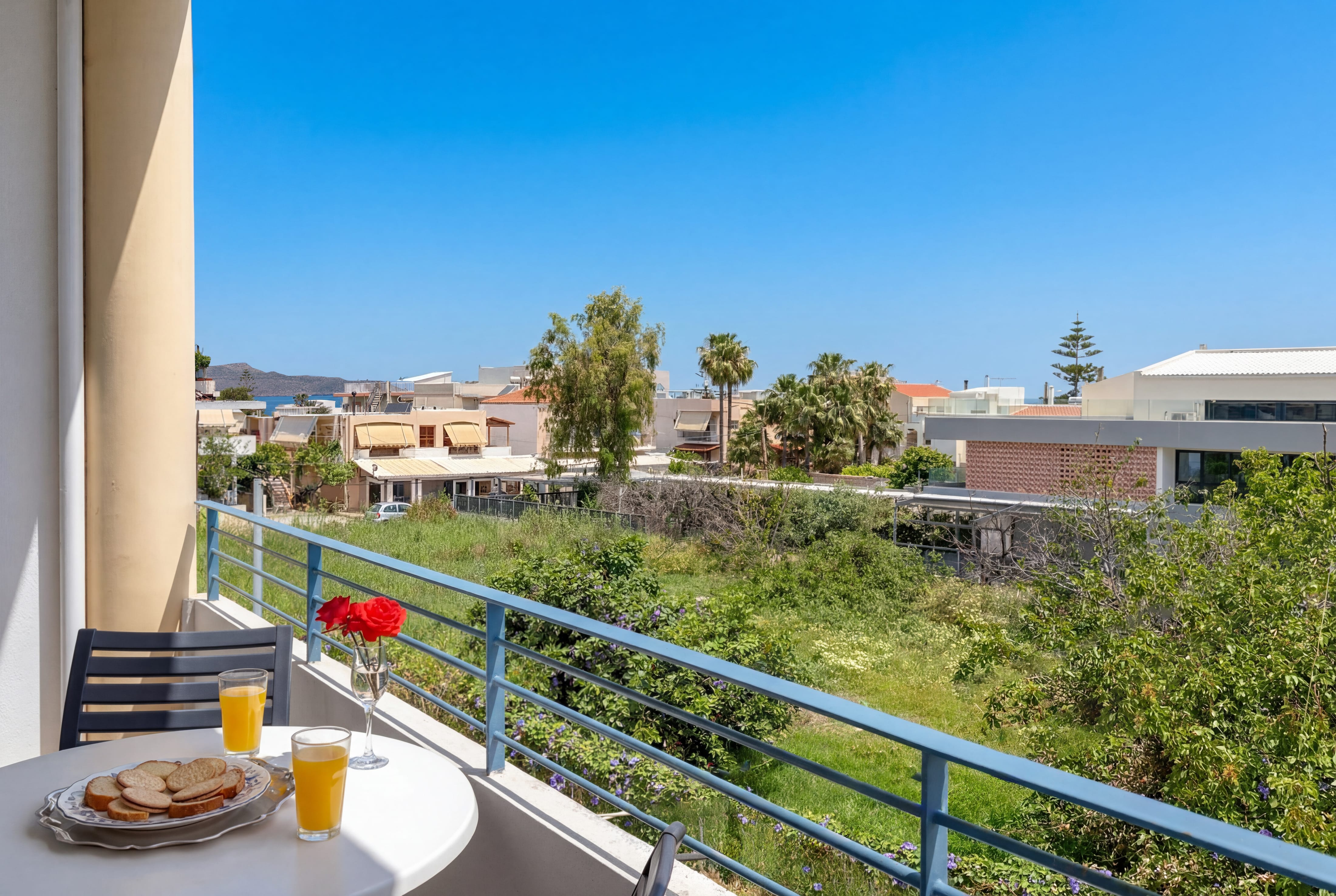 a table with food on it and a balcony with a view of the city