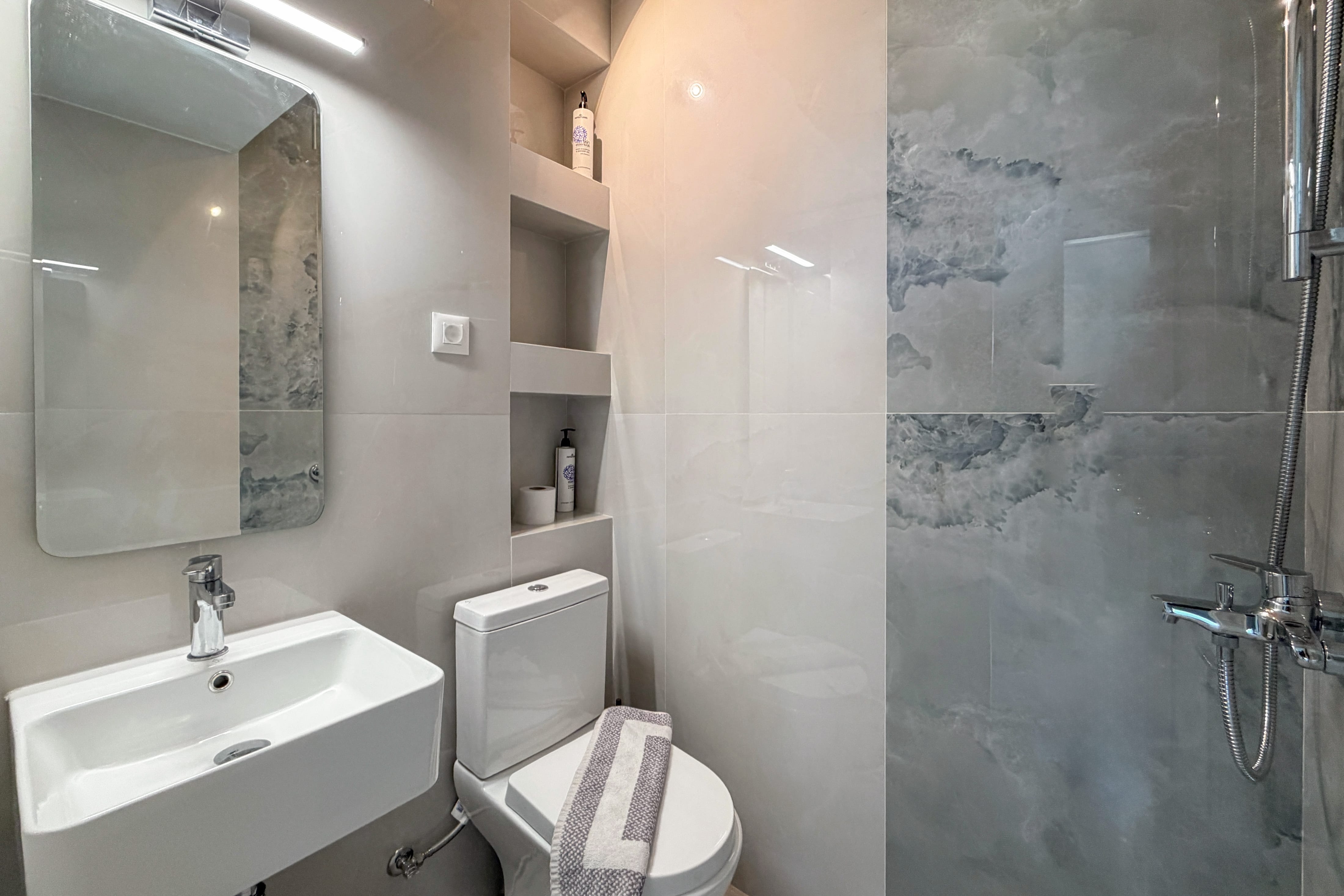 a bathroom with a sink and toilet
